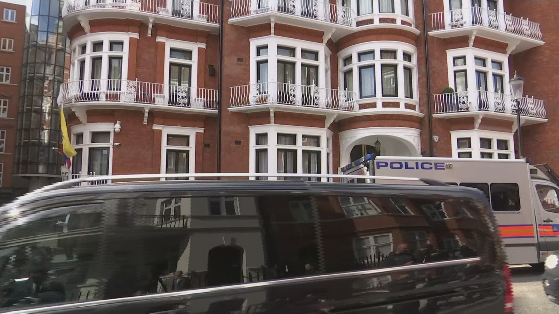 A police van was seen outside the Ecuadorian embassy in London where police said they've arrested WikiLeaks founder Julian Assange on a court warrant dating back to 2012. (AP)