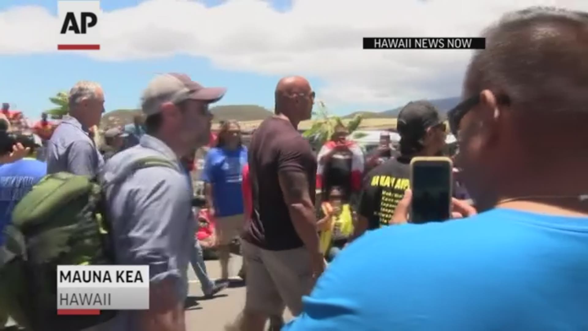 Actor Dwayne "The Rock" Johnson visited protesters blocking construction of a giant telescope on Hawaii's Big Island on Wednesday. (AP)
