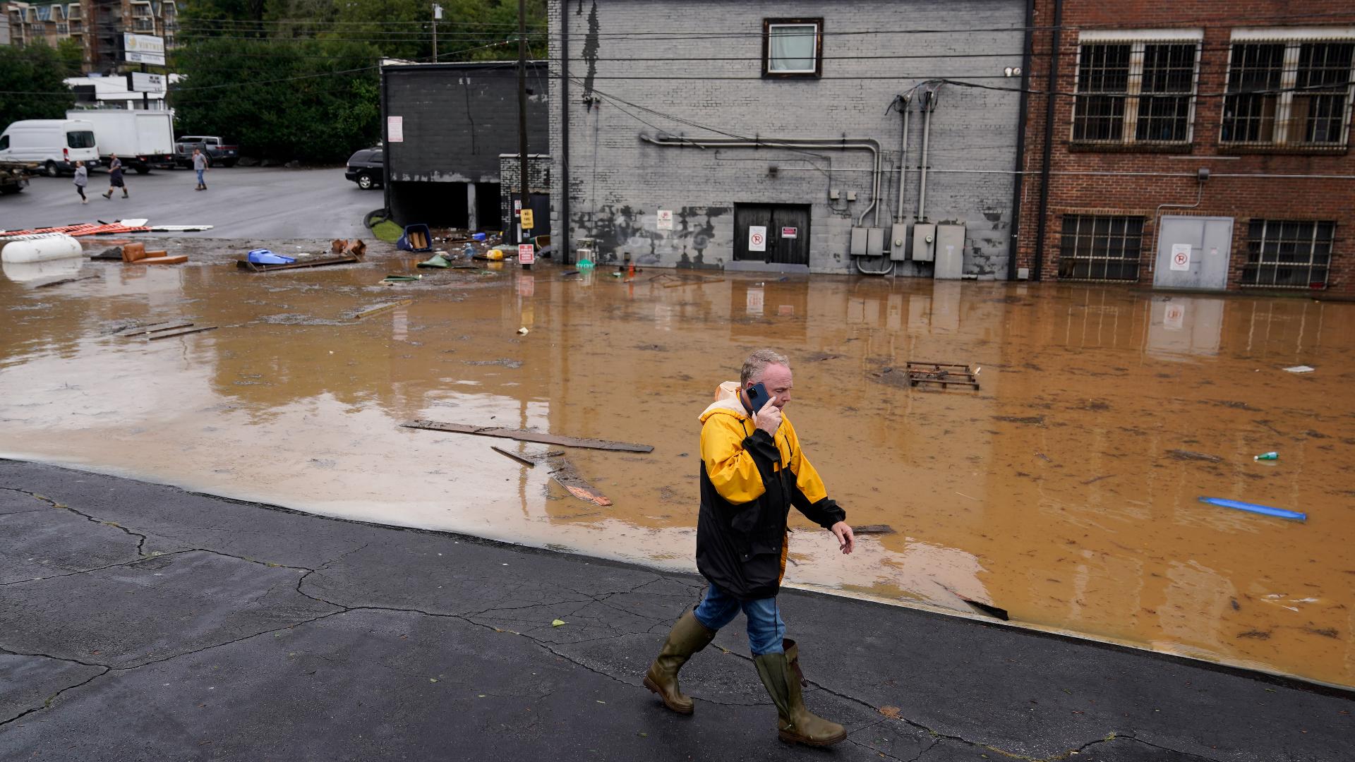 Floodwaters pushed by the remnants of Hurricane Helene left North Carolina’s largest mountain city largely cut off Saturday.