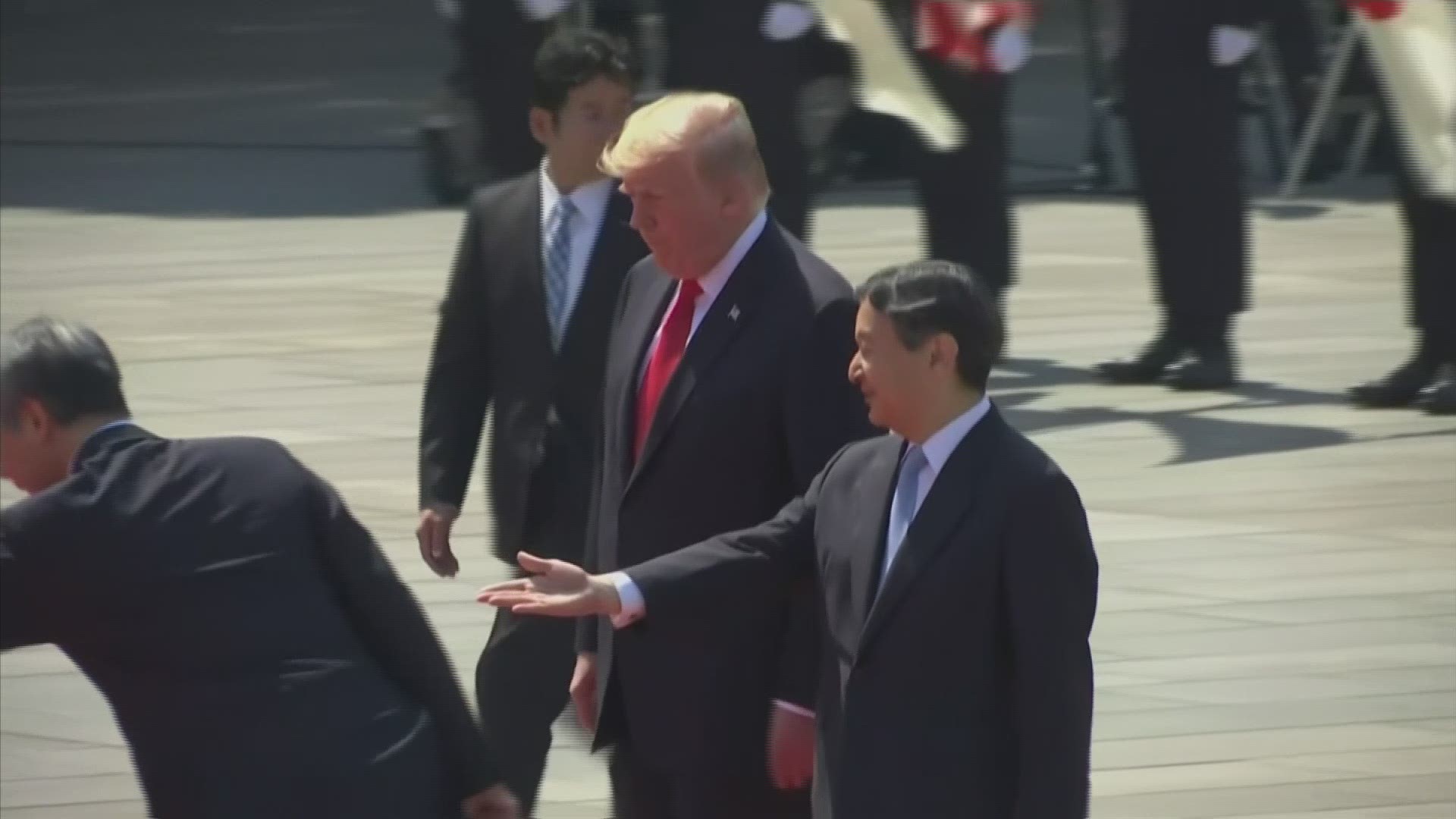President Donald Trump made history on Monday under a blazing, hot sun at Japan's Imperial Palace, becoming the first world leader to meet the new emperor of Japan. (AP)