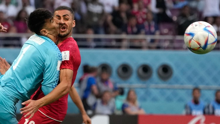 Iran goalkeeper clashes heads with teammate at World Cup