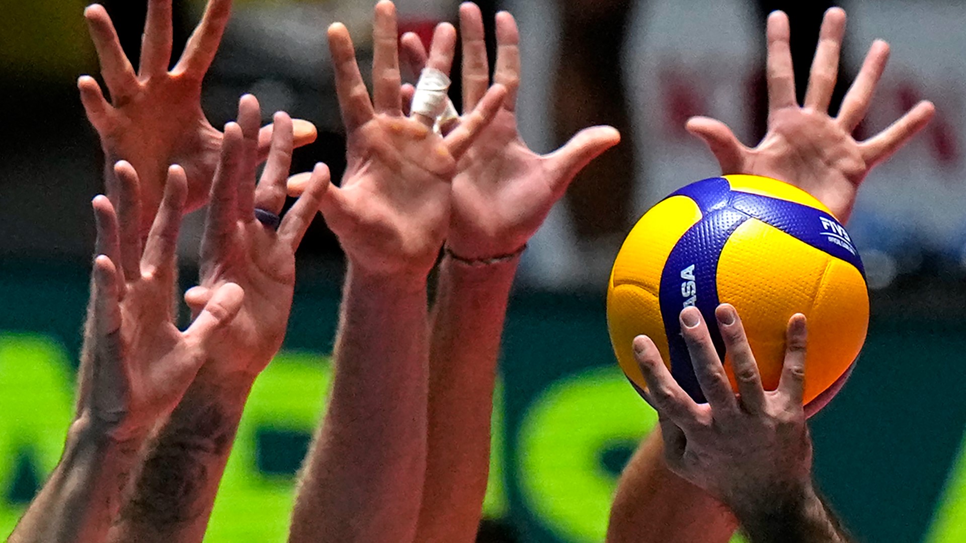 Why does one volleyball player wear a different color jersey?
