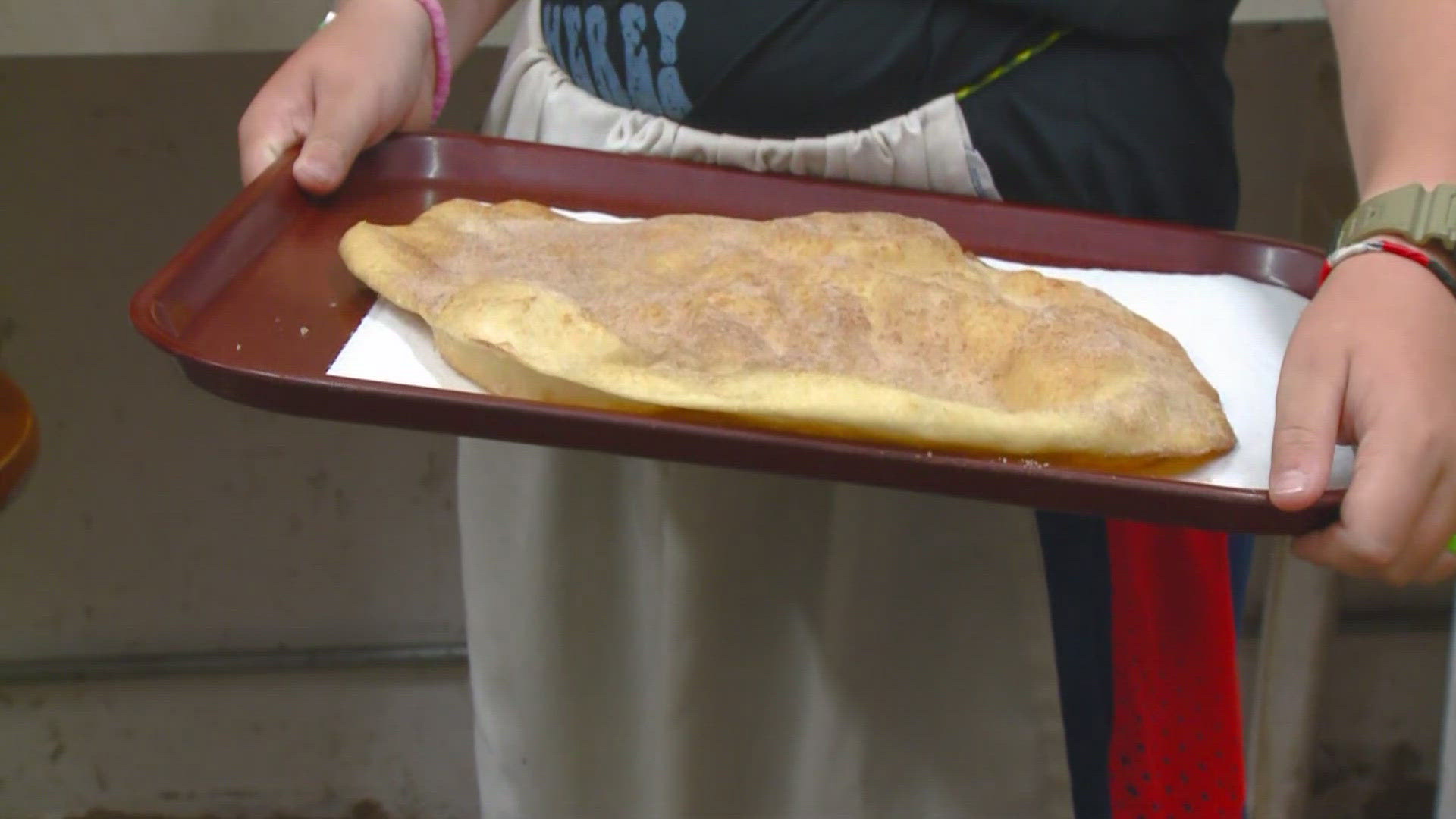 Brandon talked to the Elephant Ear vendor about what the tasty treat is and how many generations she has been doing it for.