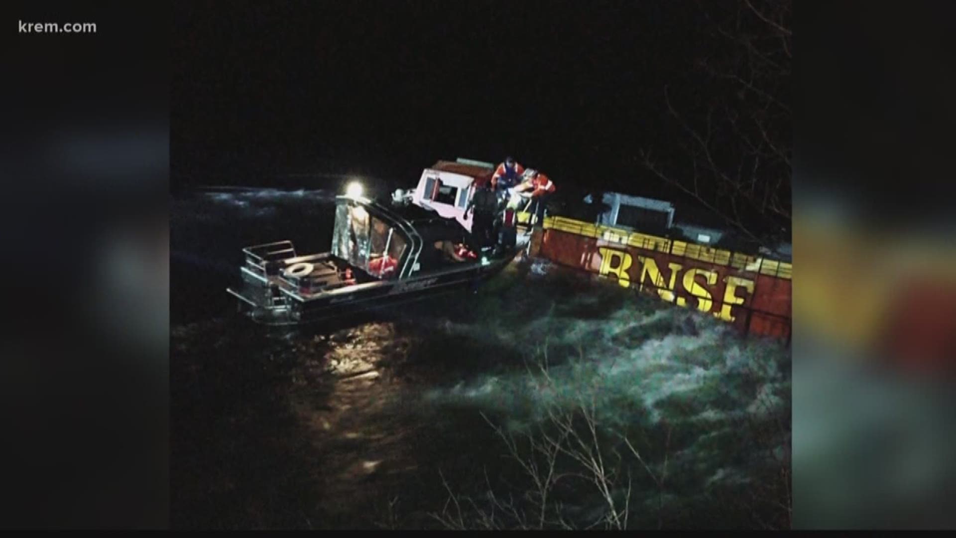 Crews are working to clear a derailed BNSF train from the Kootenai River in Boundary County. The derailment was caused by a rock slide.