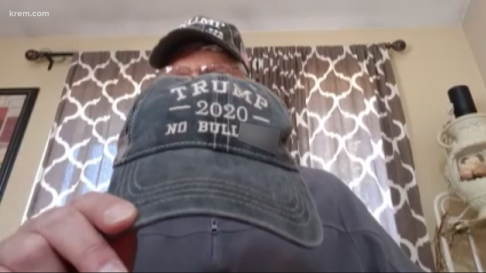 A North Idaho man says he was told to take off a hat showing support for President Trump before he was allowed to vote Wednesday.