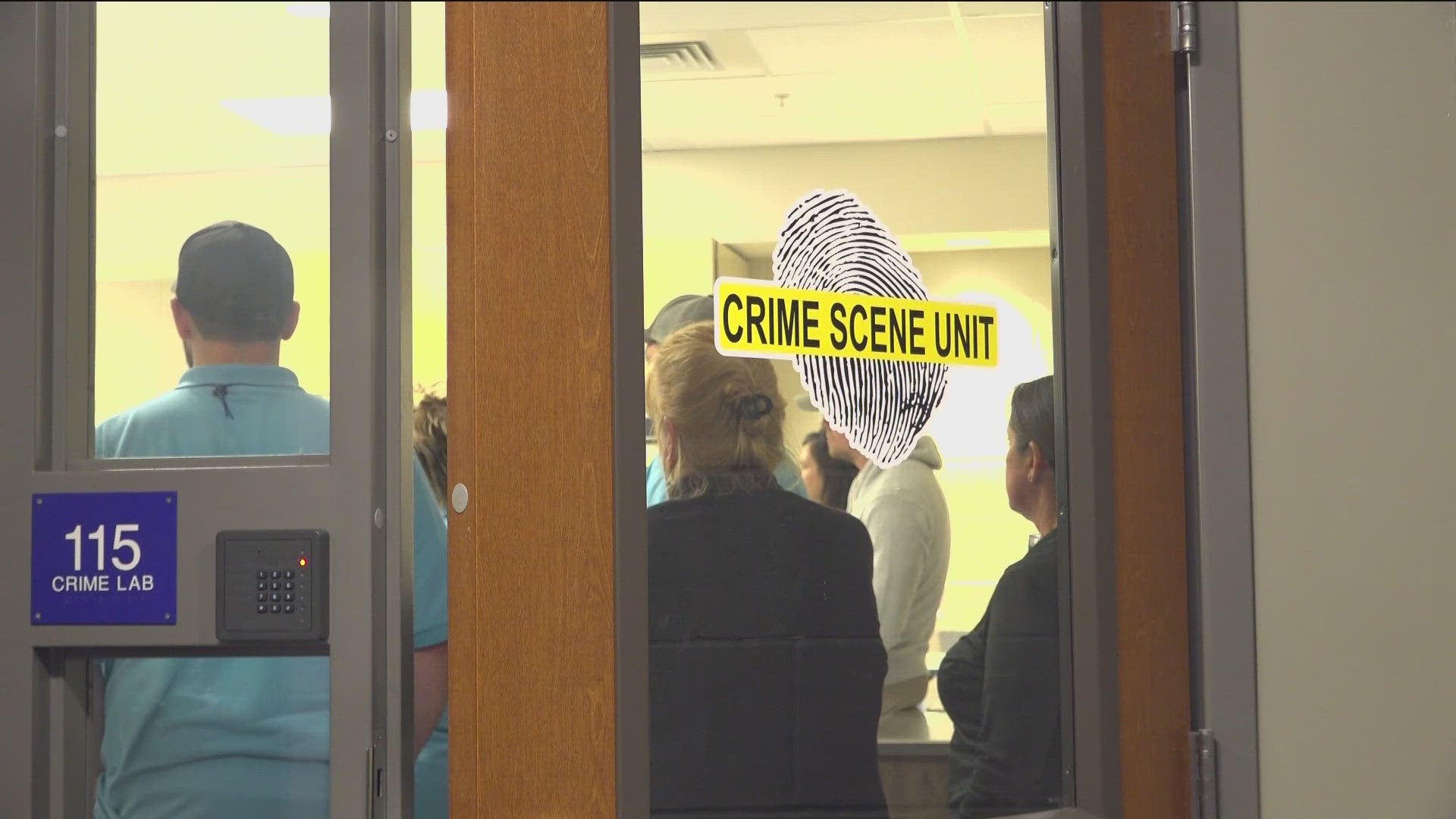Students at the Twin Falls Citizens Police Academy test their skills through a fake crime scene investigation.