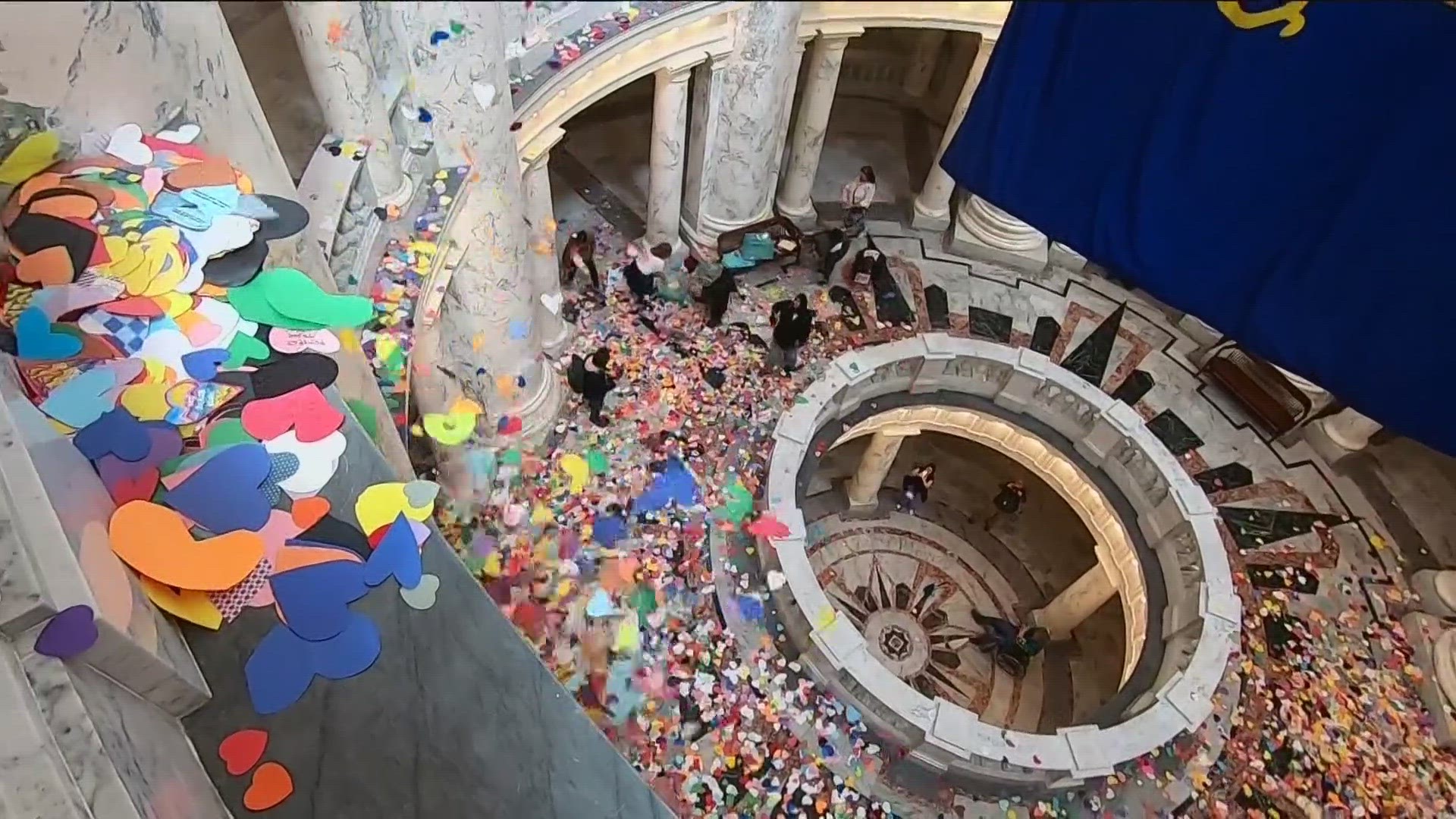 More than 48K paper hearts handmade by LGBTQ allies were dropped from the fourth floor of the rotunda at the Idaho State Capitol in protest of LGBTQ legislation.
