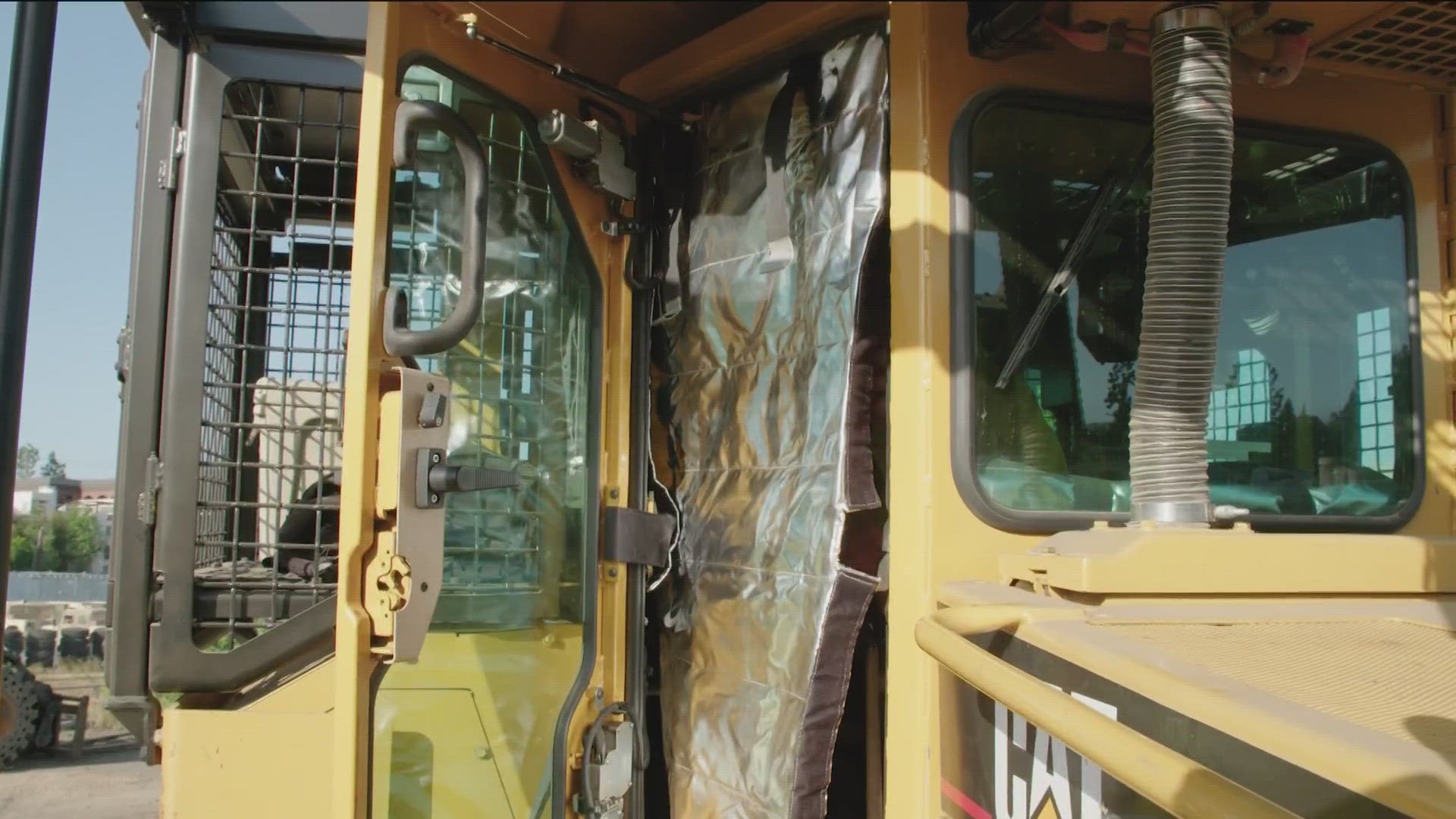 Fire barrier curtains will protect firefighters trapped by flames in engines, dozers and brush trucks, but they aren't commonly used in Washington state.