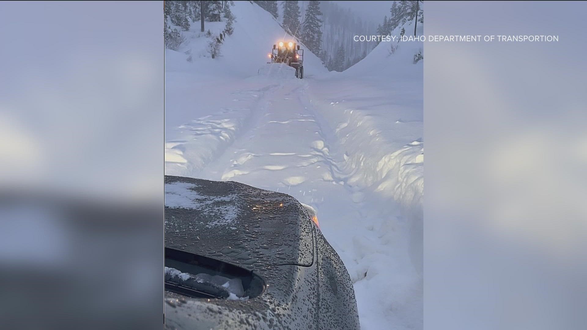 The Idaho Transportation Department (ITD) said the maintenance employee was able to plow around the couple's high-centered vehicle, which was close to an avalanche.