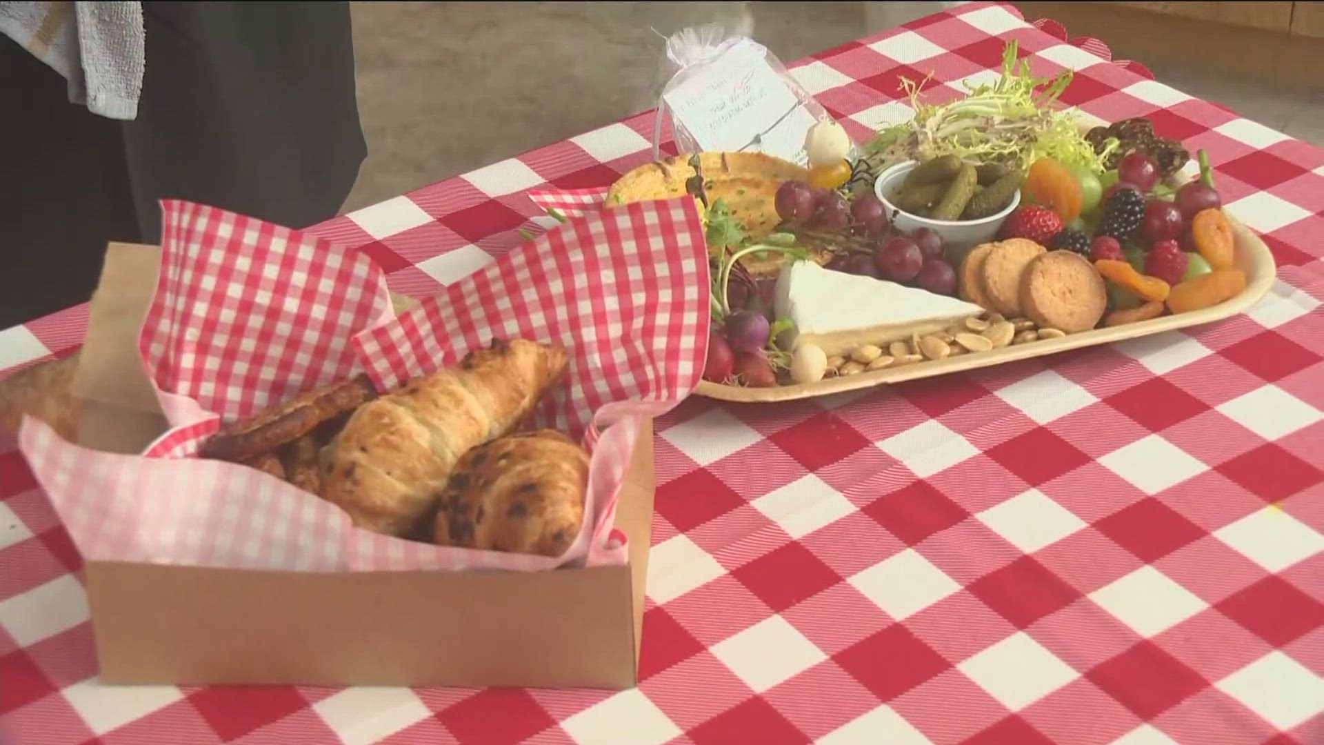 Chef Anna Tapia helps KTVB's Morgan Romero and Brian Holmes celebrate the start of the 2024 Paris Olympics in style at Jack's Urban Meeting Place.