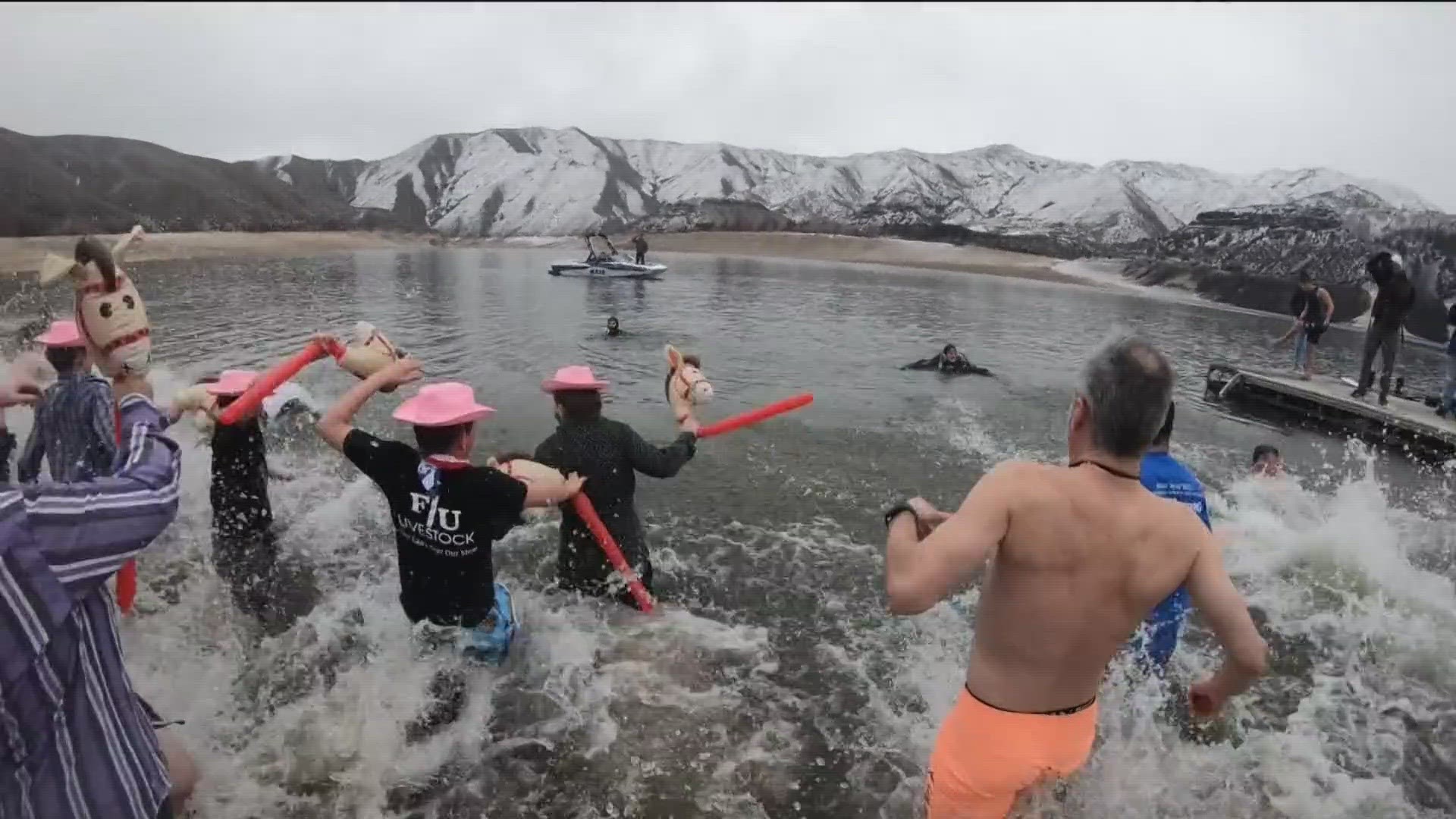 The event, at Lucky Peak Reservoir, saw over 400 people take an ice-cold dip for charity.