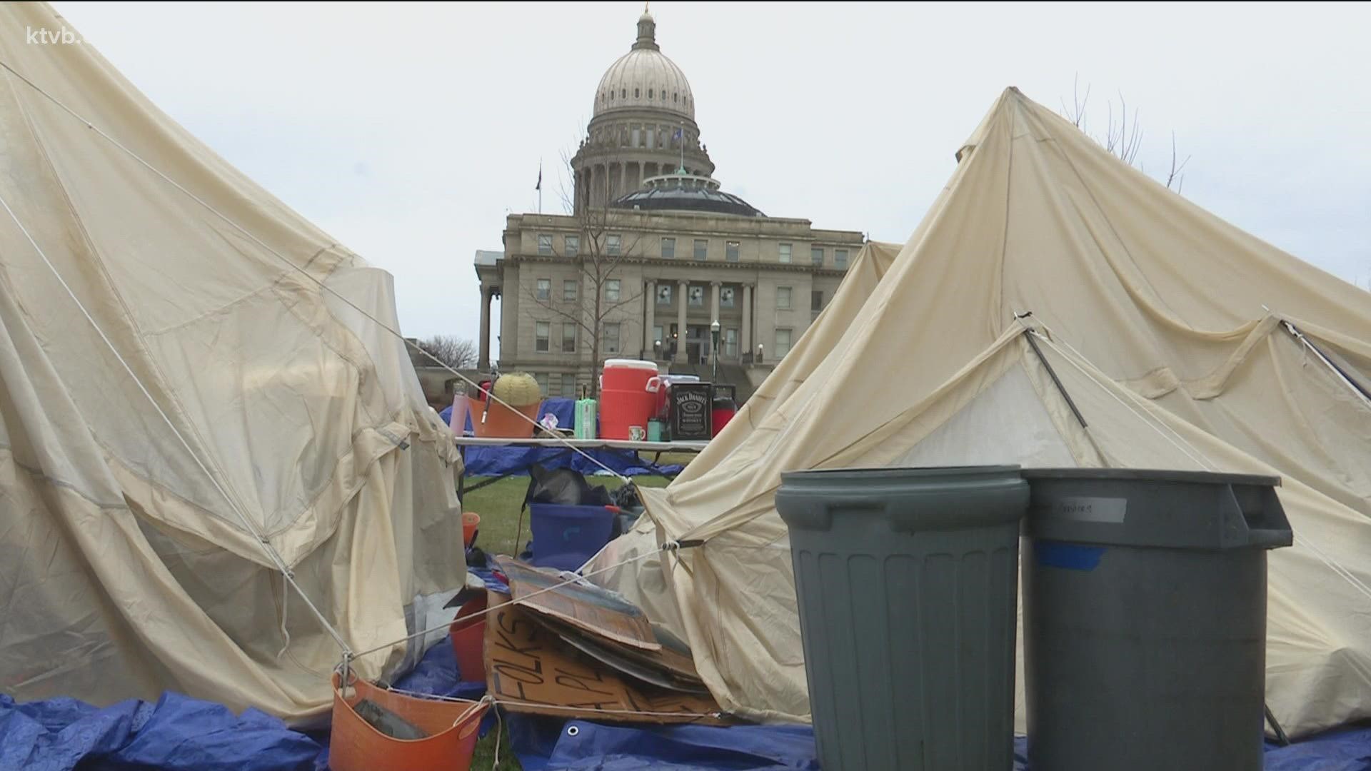 The demonstrators say they're trying to draw attention to a dire lack of housing, but the governor says the area contains "dangerous health and safety violations."