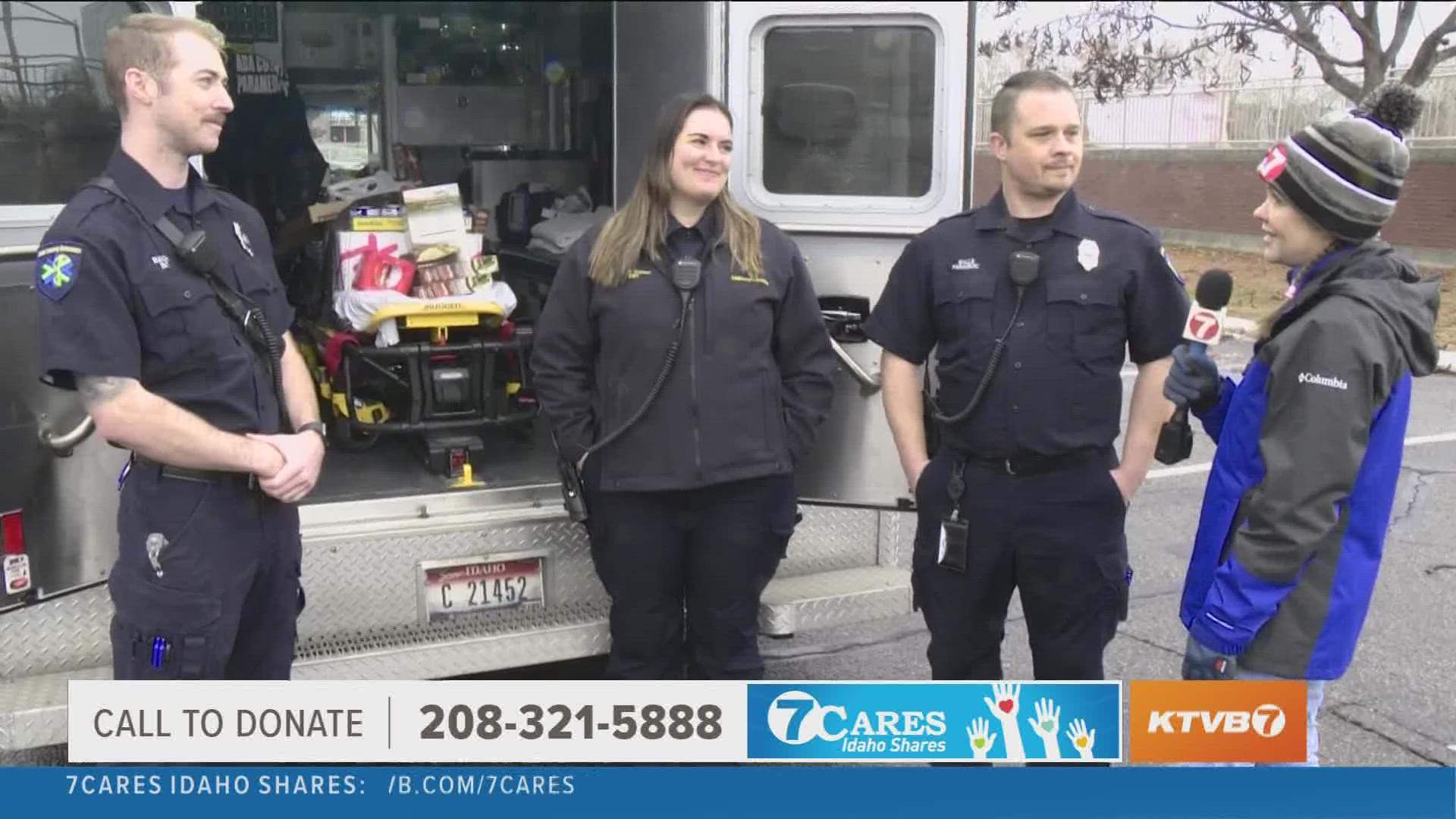 Ada County Paramedics make donation to 7Cares Idaho Shares.