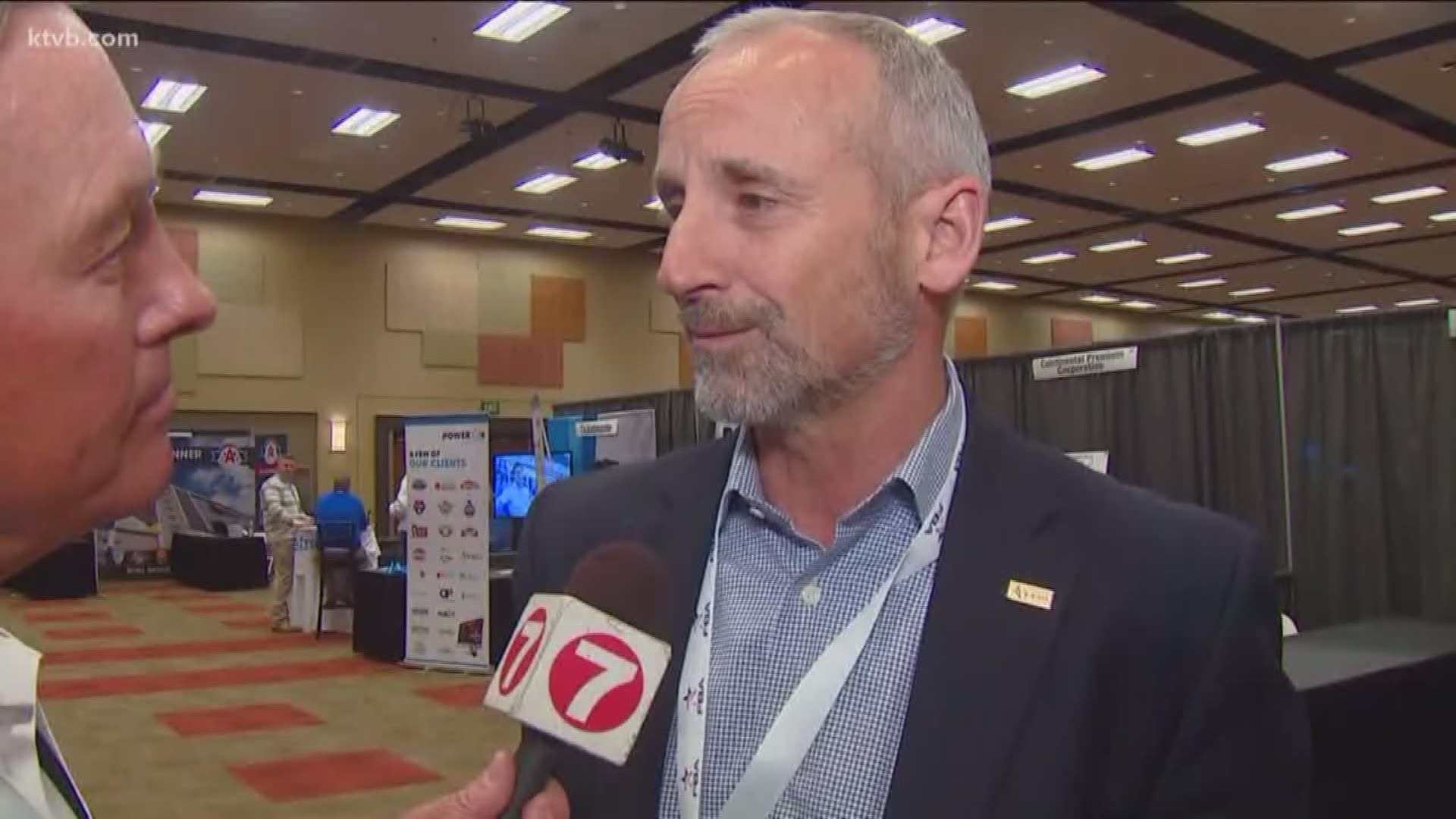 Mark talks with Famous Idaho Potato Bowl Executive Director Kevin McDonald, who played an important role in bringing the Football Bowl Association's annual meeting to Boise.