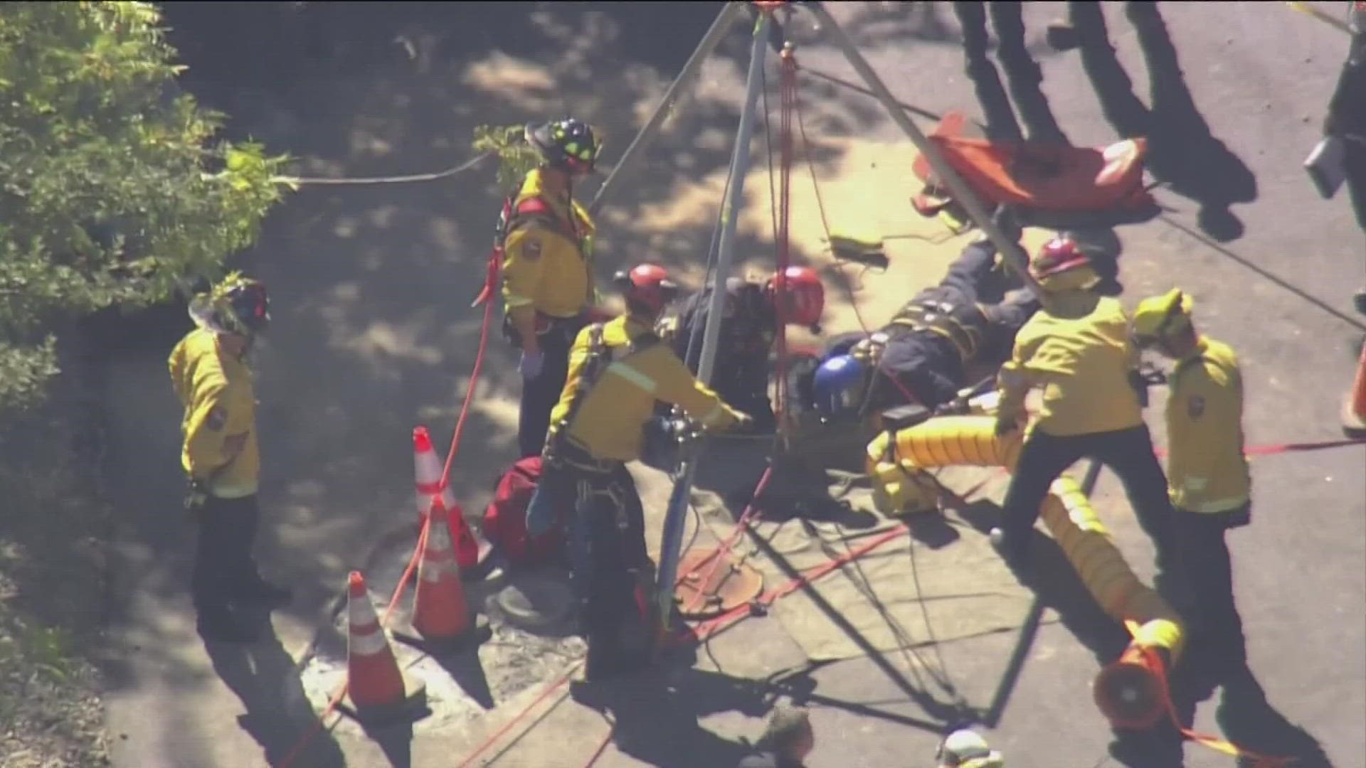 Firefighters rescued a road construction worker who fell about 20 feet down a manhole in California Thursday.