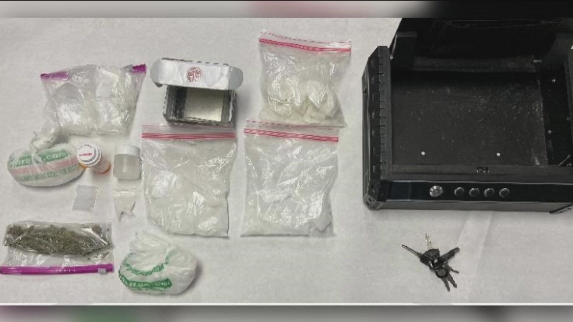 During the arrest, police located two pounds of Methamphetamine, five ounces of Marijuana, packing materials, scales, various paraphernalia, and a loaded firearm.