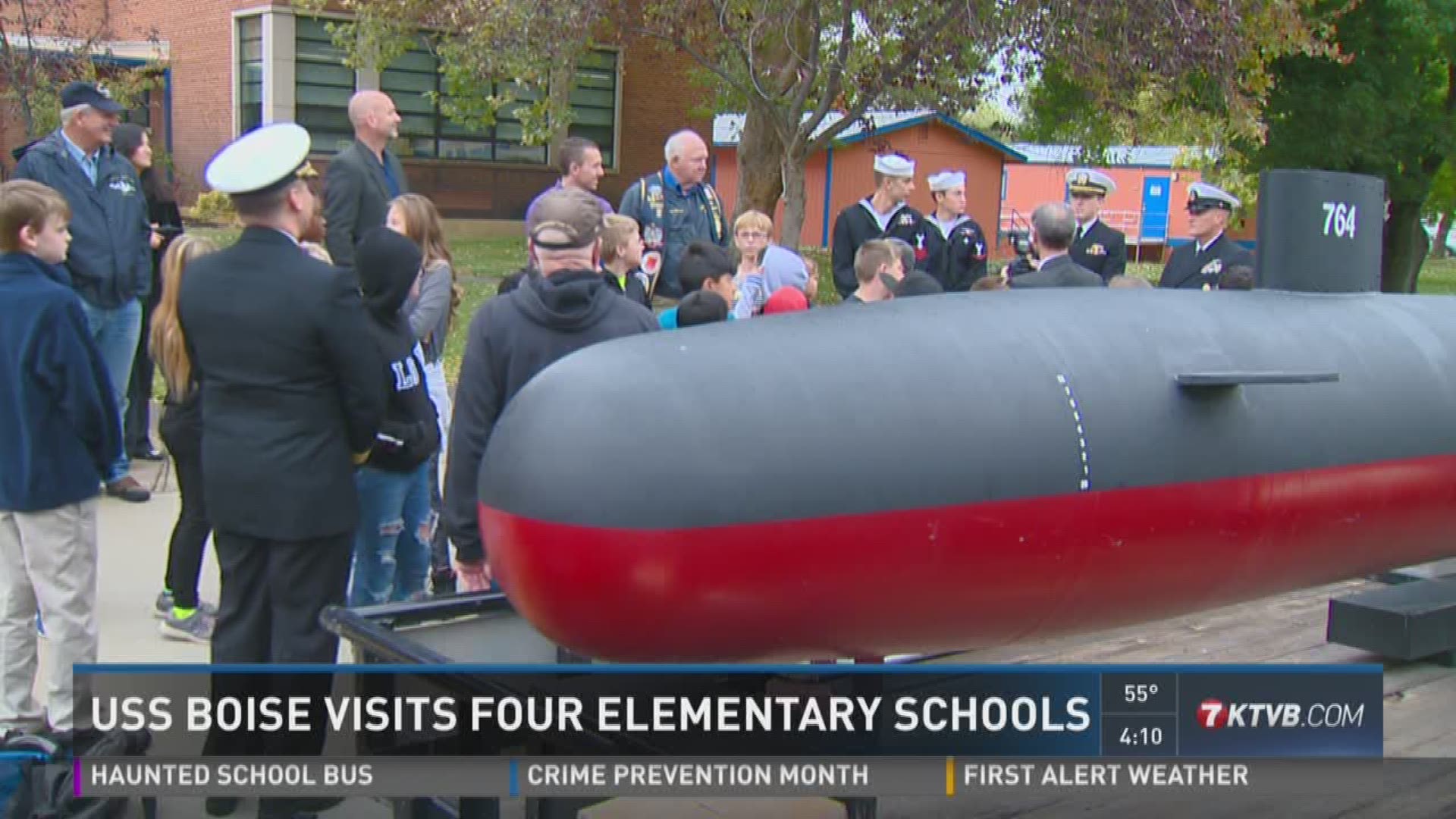 Crew members from the USS Boise visited four elementary schools in the Boise School District on Monday.