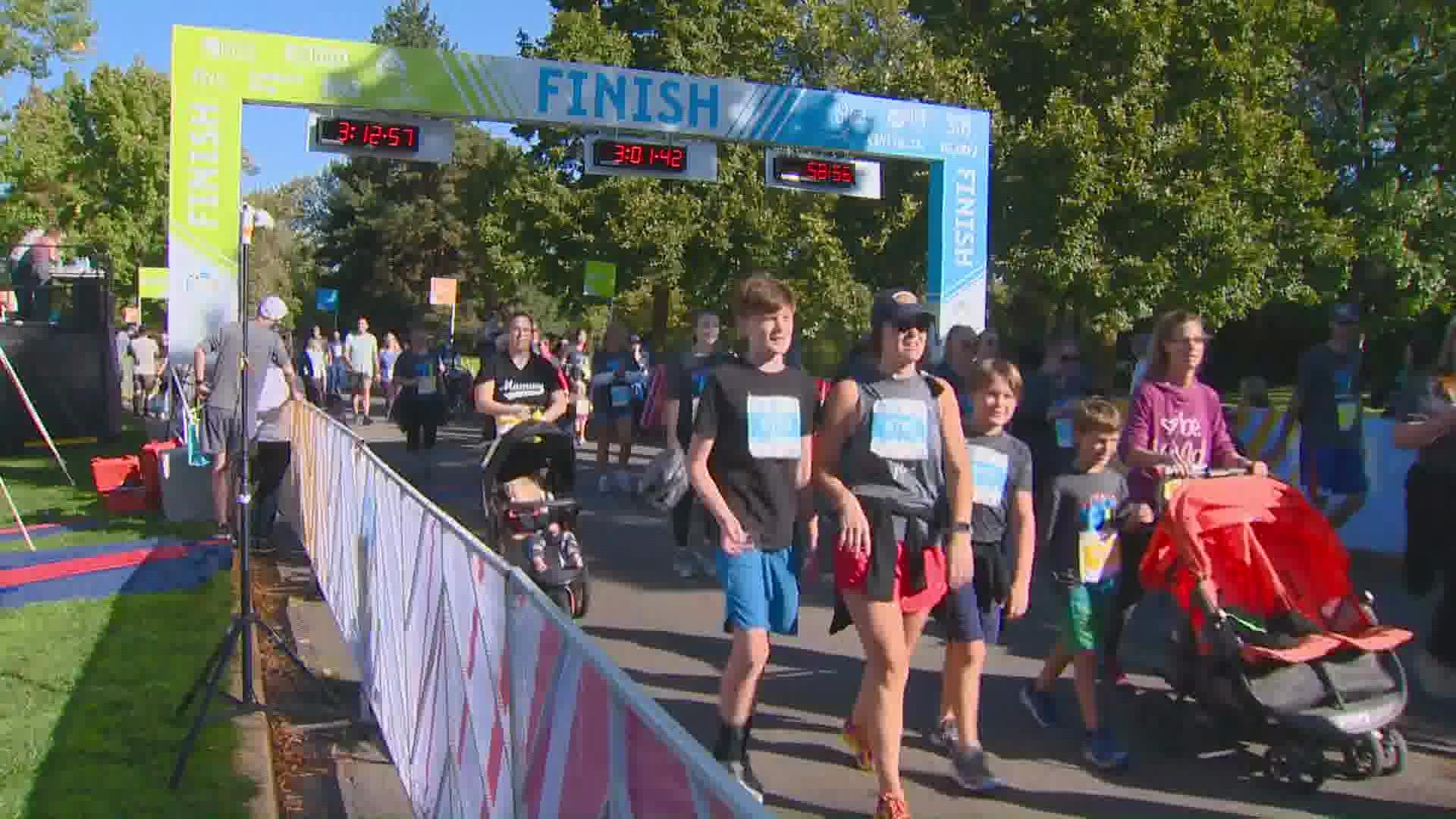 St. Luke's FitOne race runners crossing the finish line.