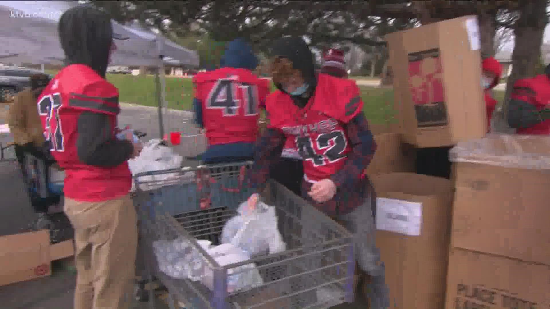 The new Owyhee High School football team at the Ten Mile-Cherry Ln. Albertsons, helping your food donations get to where they need to go.