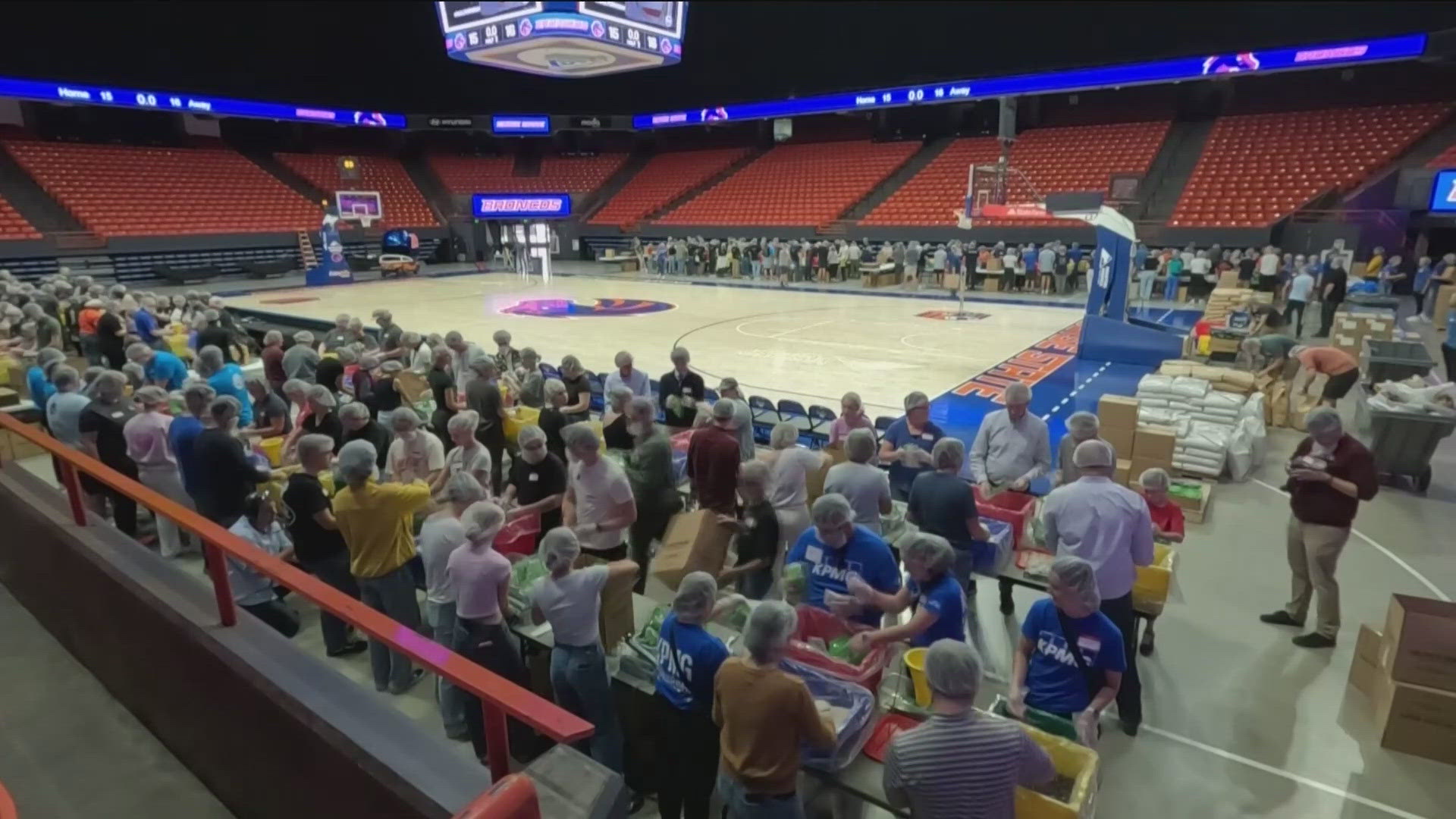 Hundreds of volunteers packed ExtraMile Arena on Friday to pack roughly 100,000 meals for food banks in the Gem State.