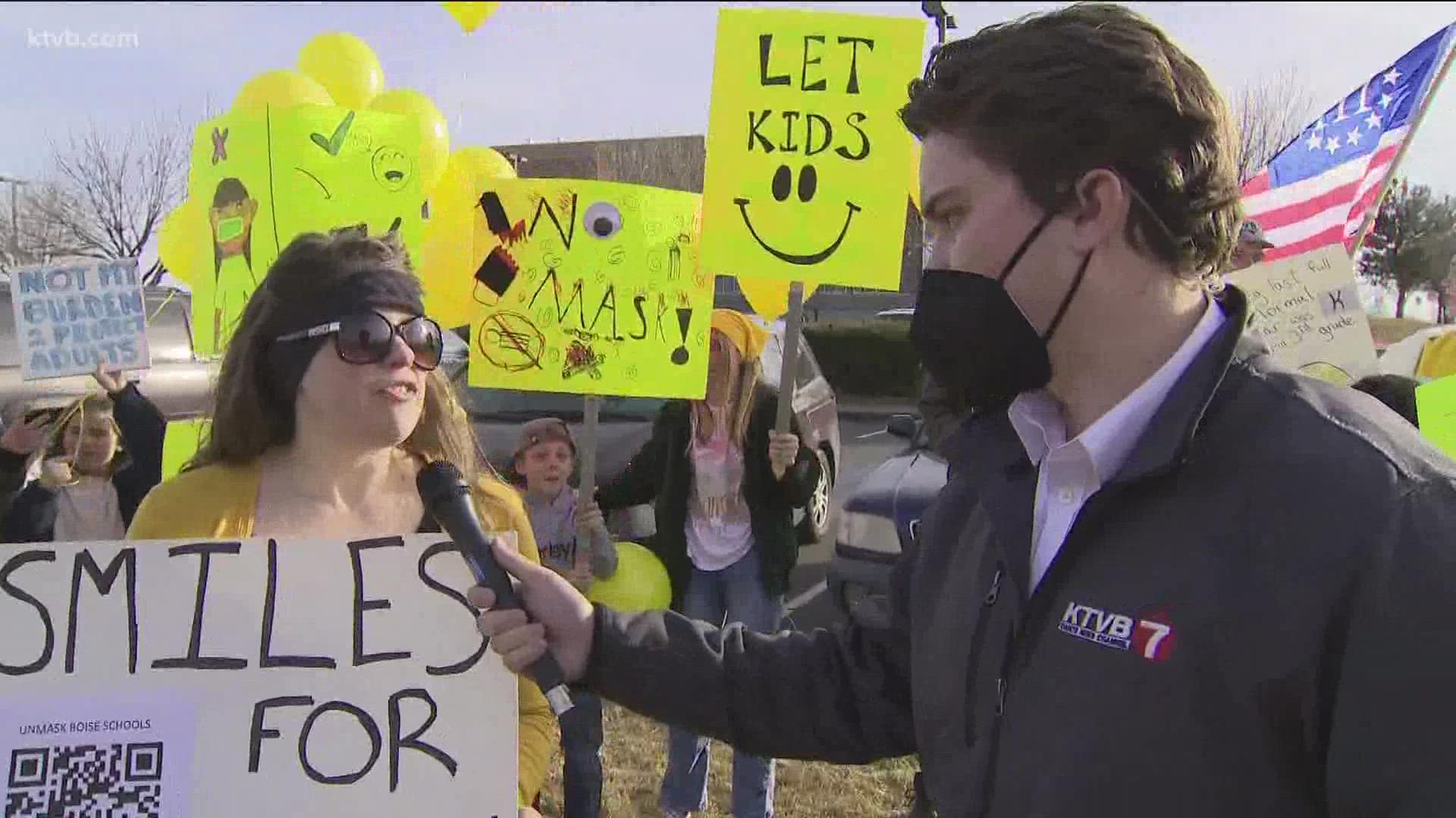 Parents gathered Friday afternoon outside the Boise School District office in favor of ending the district's mask mandate ahead of its board meeting Monday, Feb. 14.