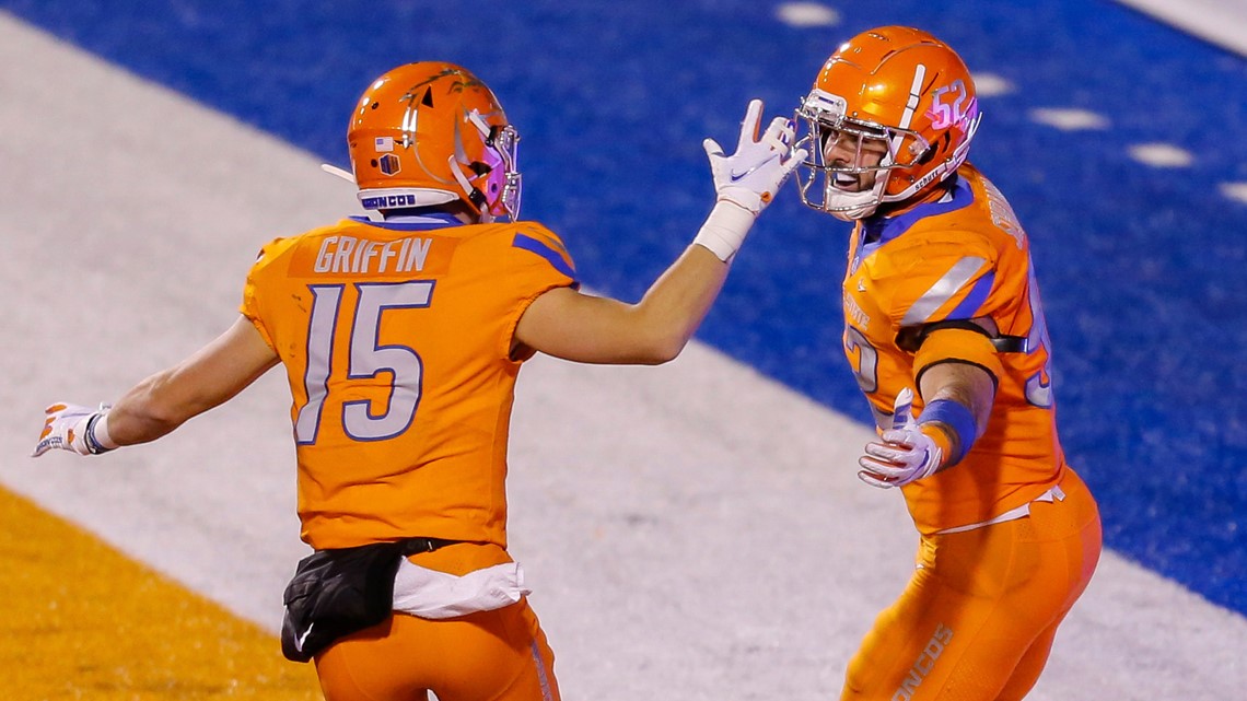 BOISE, ID - OCTOBER 21: Boise State Broncos cornerback Avery Williams (26)  leads his teammates onto the field with 'the hammer' during the regular  season game between the Wyoming Cowboys verses the