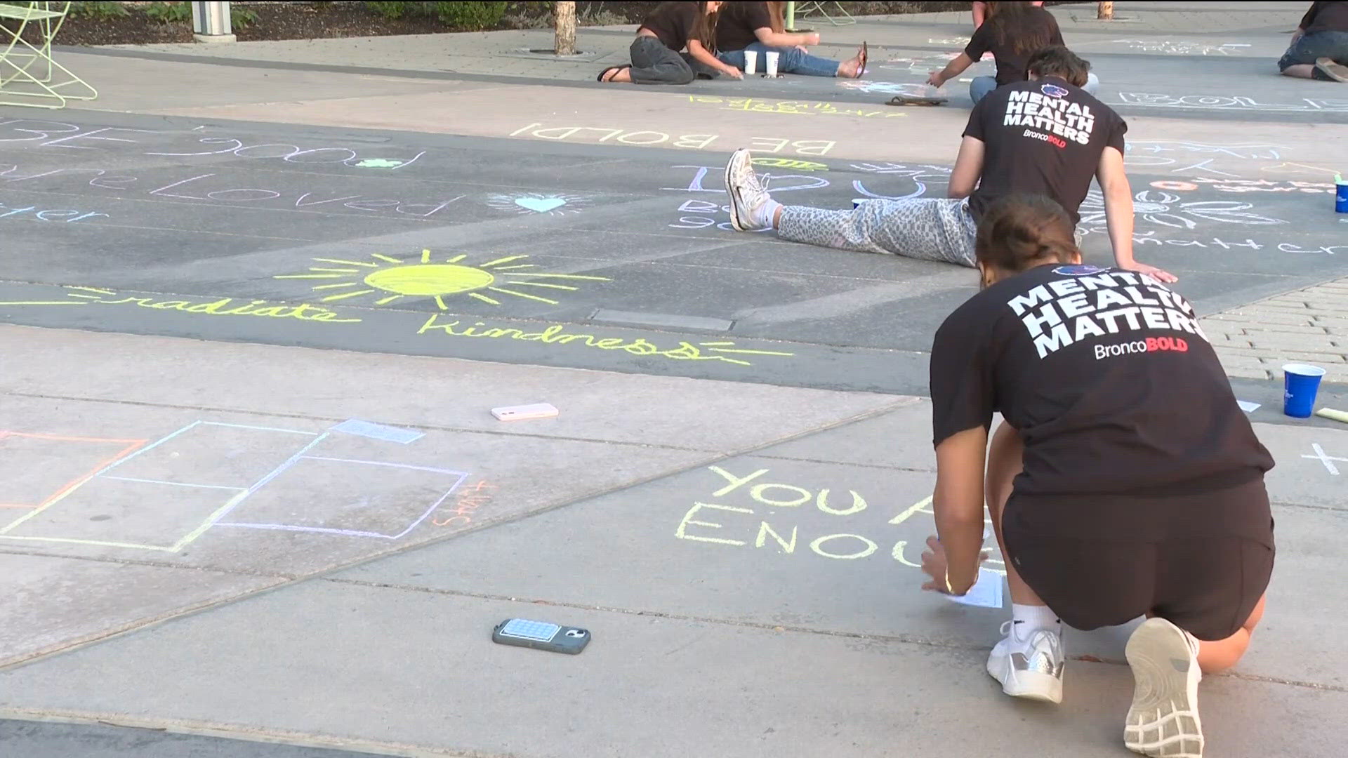Boise State athletes and locals chalk streets to promote mental health awareness