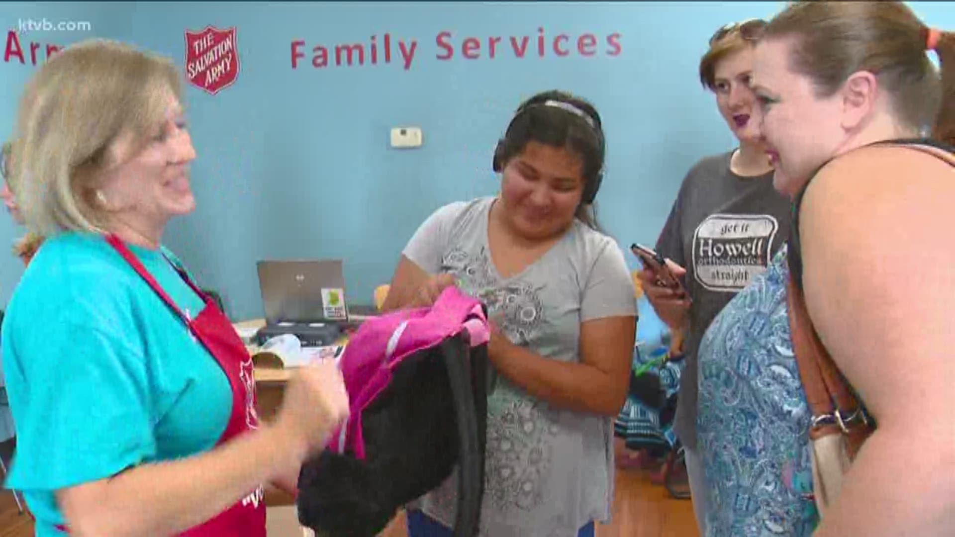 The backpacks went to needy children and will help their families save big for school.