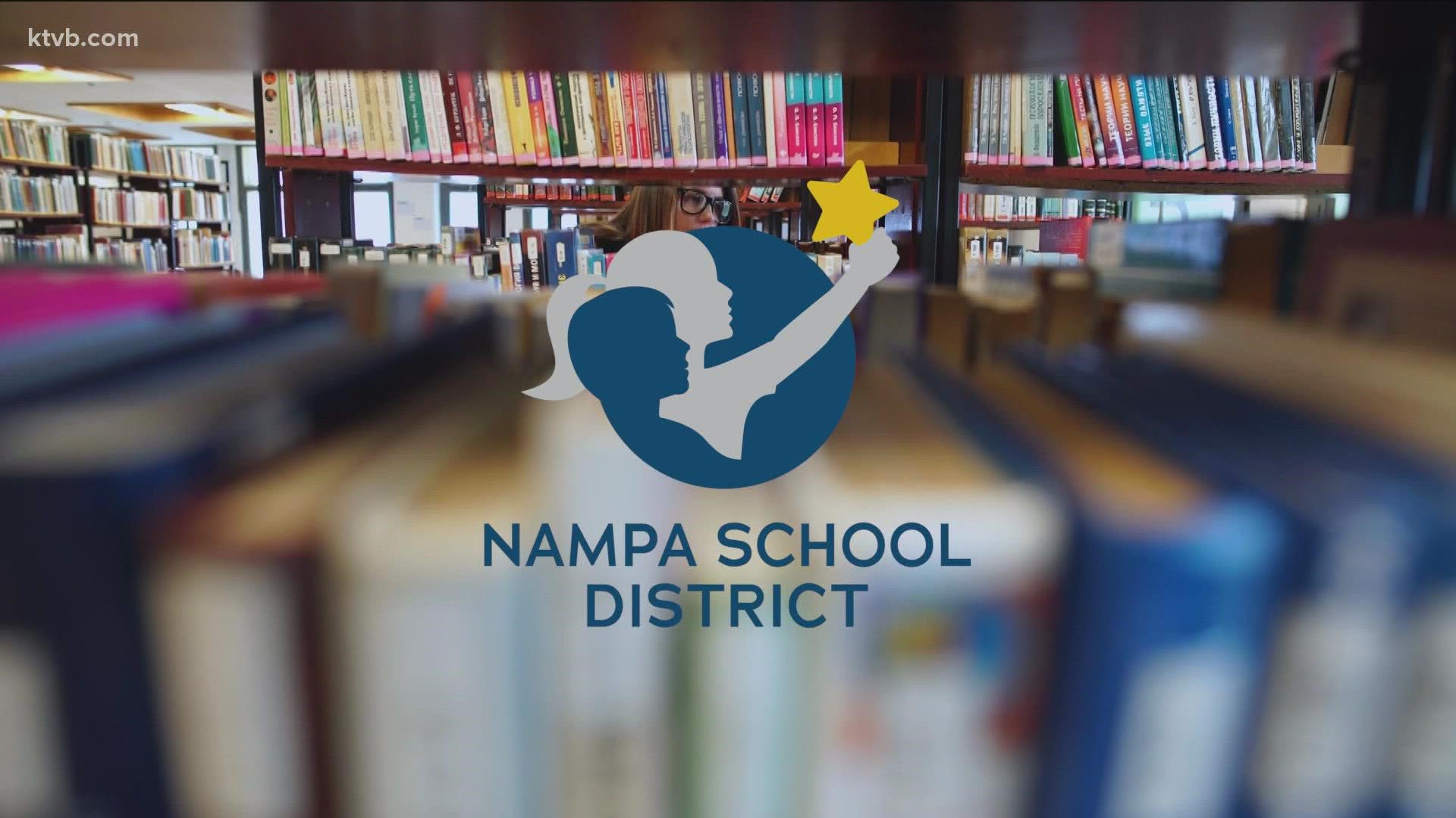 Two people dressed as handmaids from Margaret Atwood’s novel, “The Handmaid’s Tale,” entered the Nampa School District’s board room and took a seat in the front row.