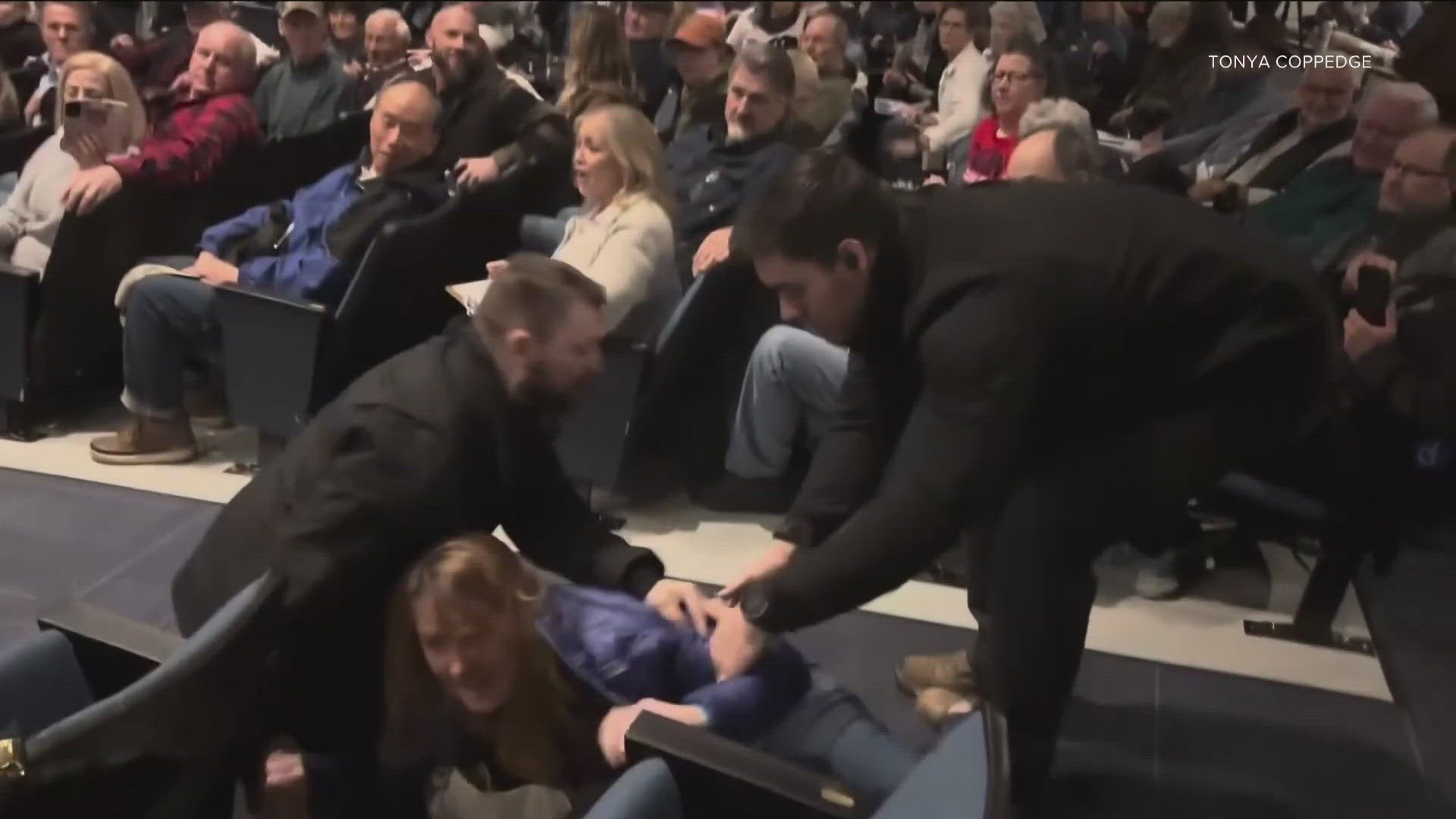 Sheriff Bob Norris will not face battery charges for allegedly removing a woman from a town hall event, after the AG's office found he did not "act in bad faith."