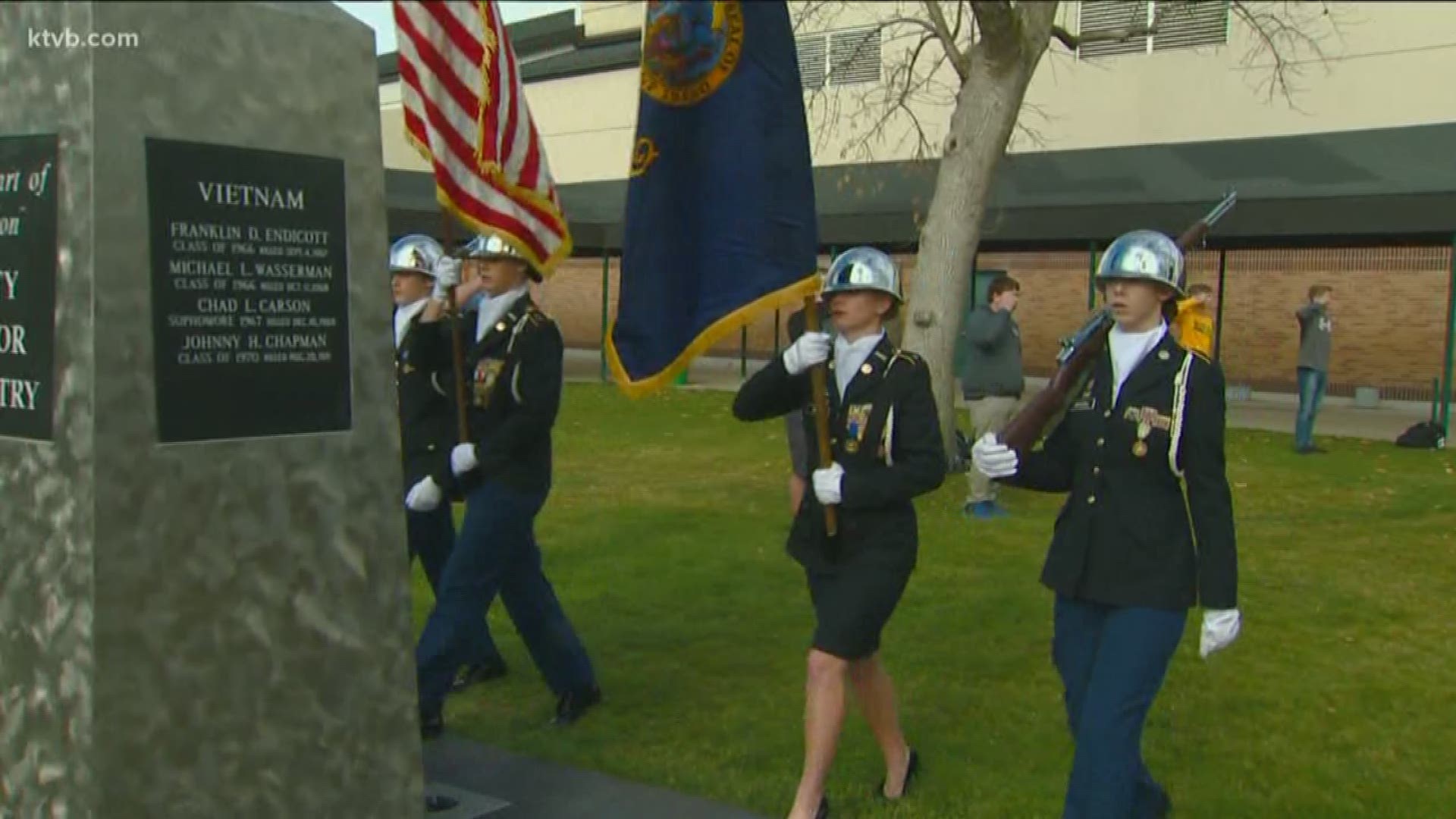 Students gathered in the courtyard and laid a wreath to remember all those who served.