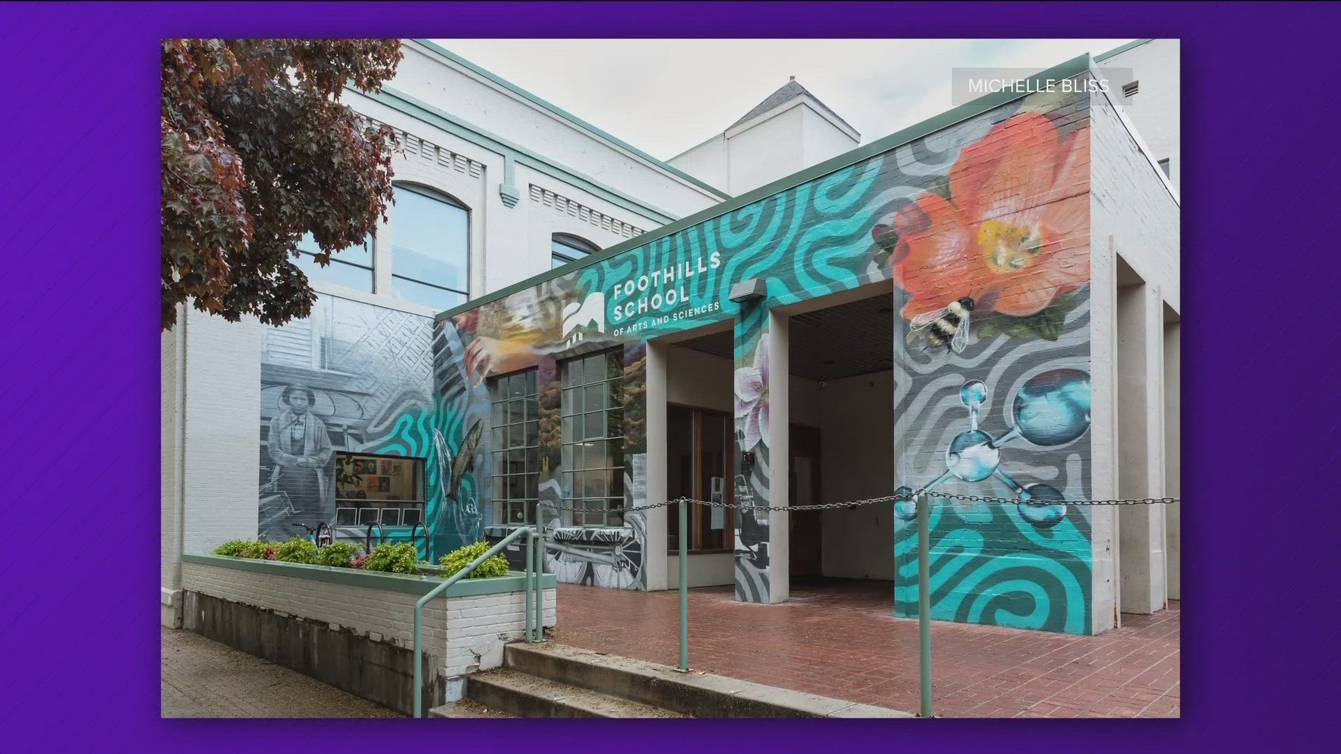 The mural, painted by Hawk Sahlein and Collin Pfeifer,  honors the neighborhood and features a photo chosen by the students.