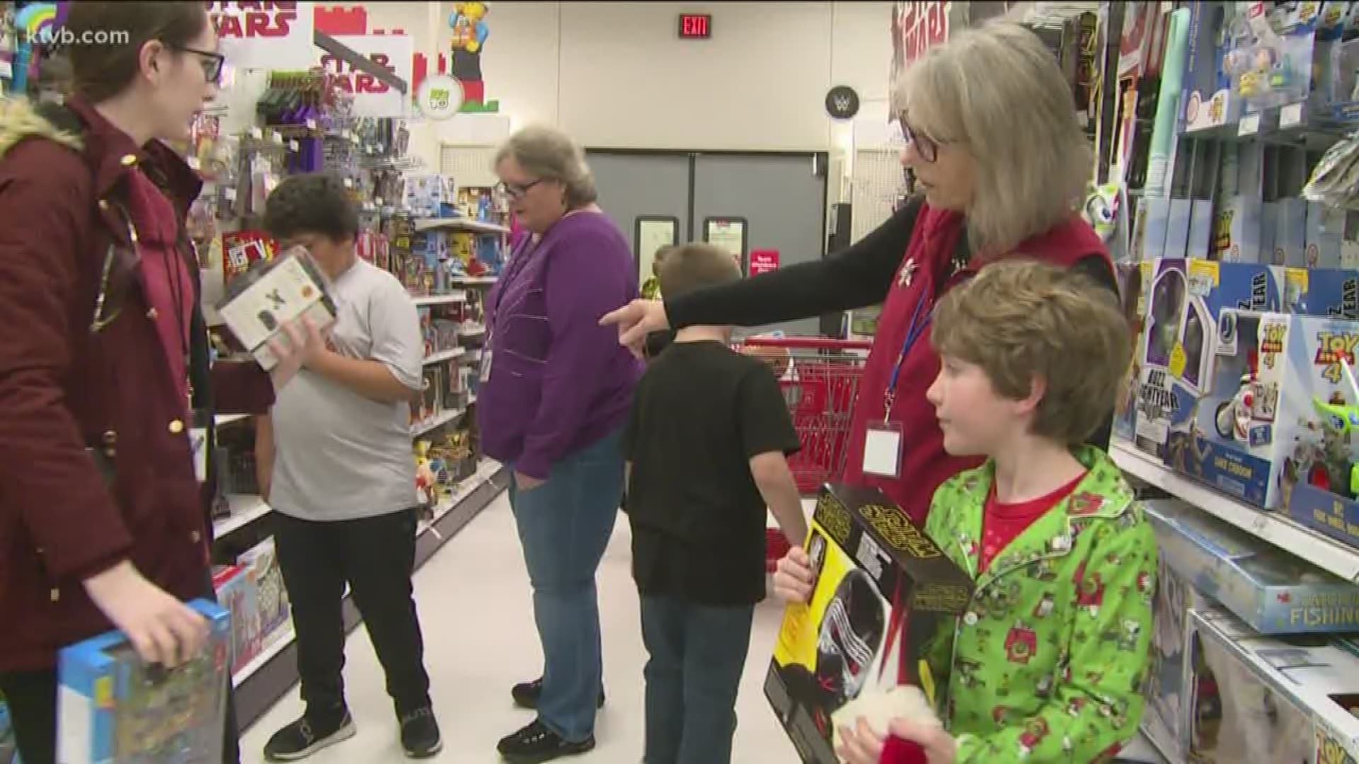 180 kids were given gift cards to go on a shopping spree at Target.