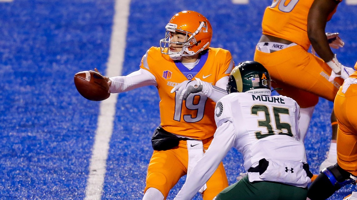 BOISE, ID - OCTOBER 21: Boise State Broncos cornerback Avery Williams (26)  leads his teammates onto the field with 'the hammer' during the regular  season game between the Wyoming Cowboys verses the