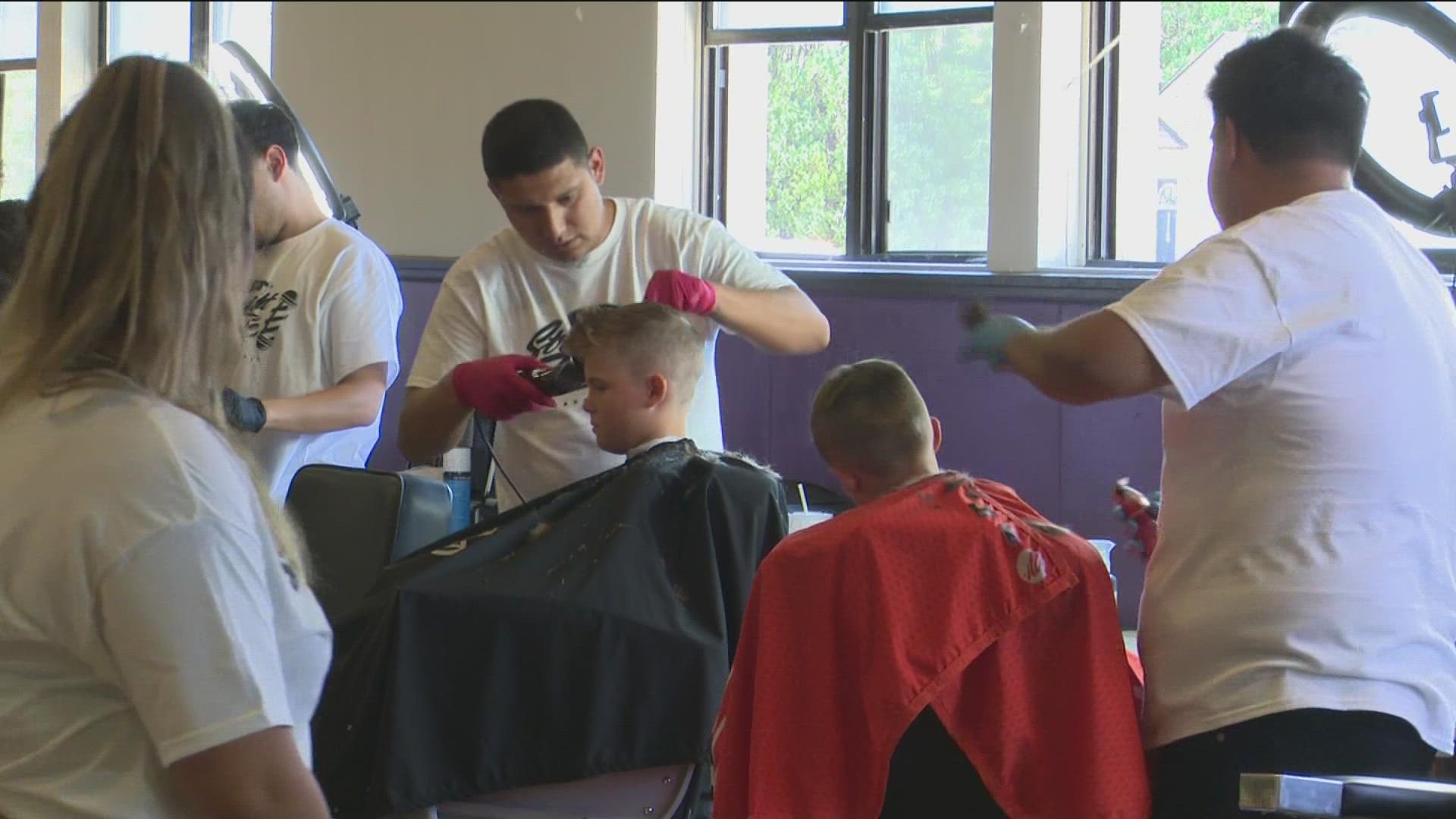 In addition to the free haircuts, the Caldwell barbers also handed out free school supplies to those in need.