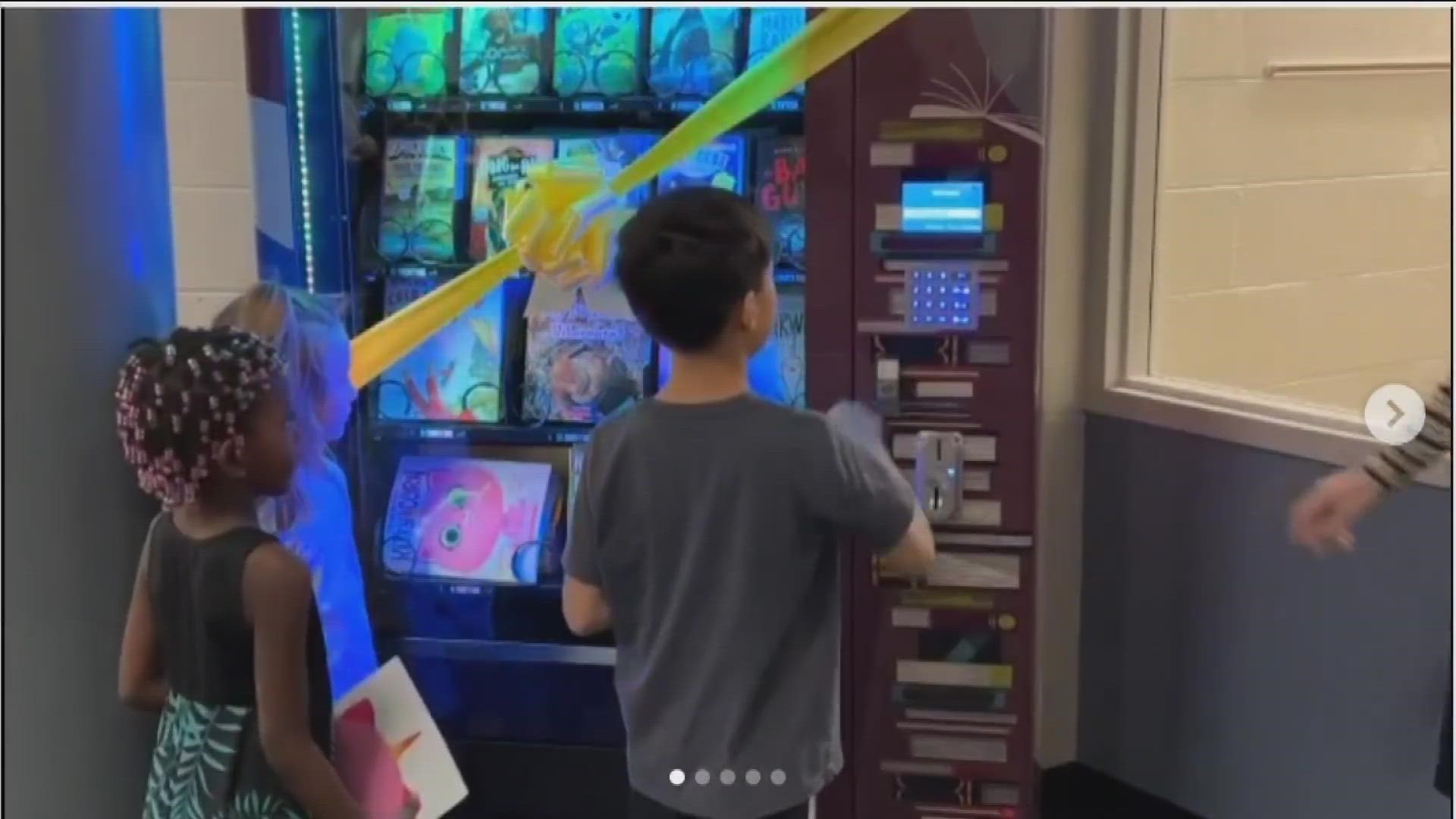 The book vending machine is used for students at White Pine Elementary School who earn tokens for successful behavior, academics and other positive actions.