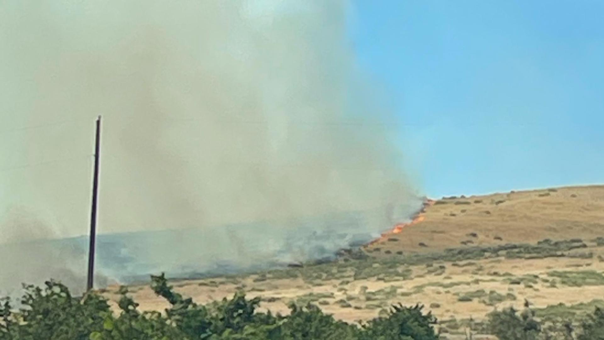 Fire officials said "forward progression has been stopped," but crews will work through the night.