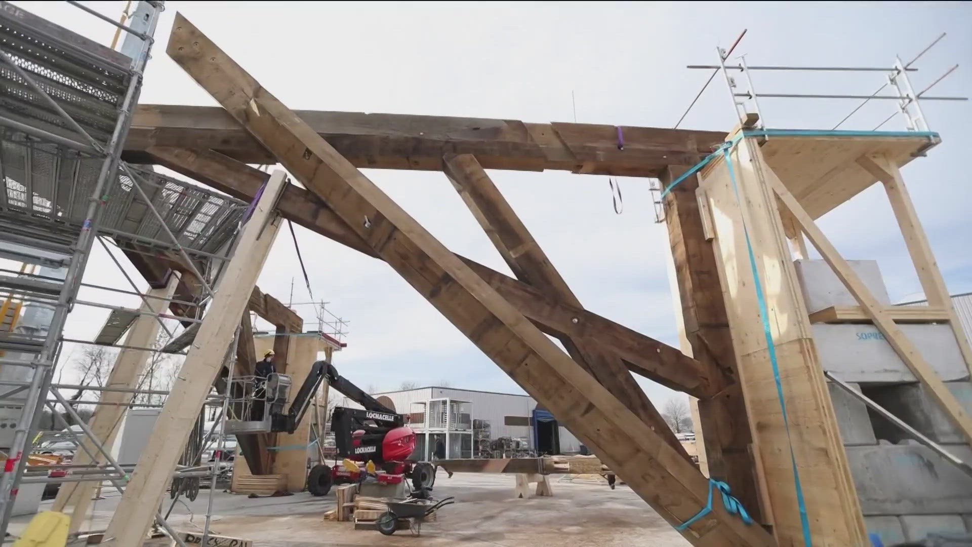 An 86,000-square-foot warehouse in northeastern France was built for the purpose of rafting Notre Dame's wooden spire. The first layer is nearly done.