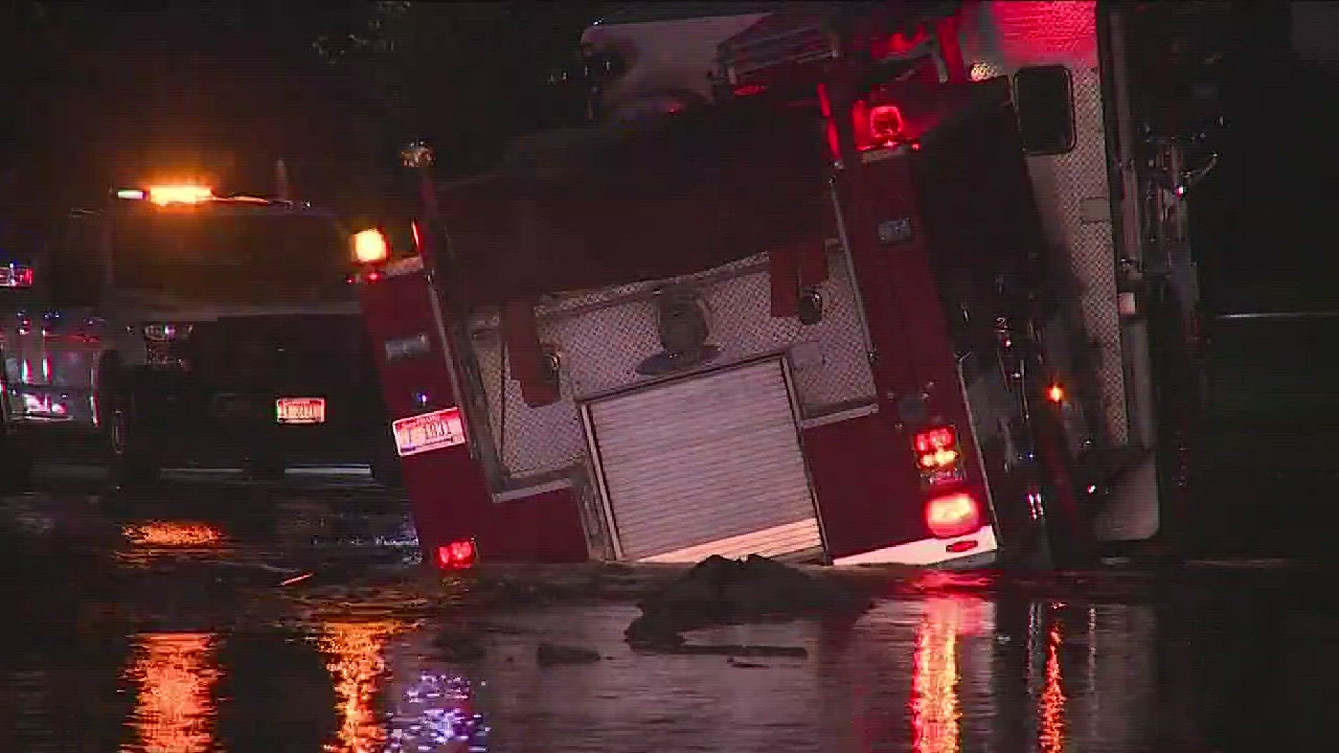 Fire engine falls into sinkhole.