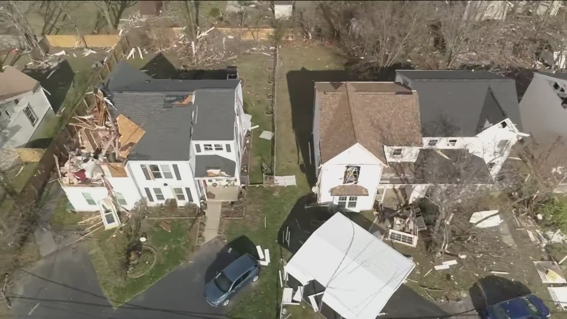 Communities worked to begin repairing damaged houses with strewn debris.