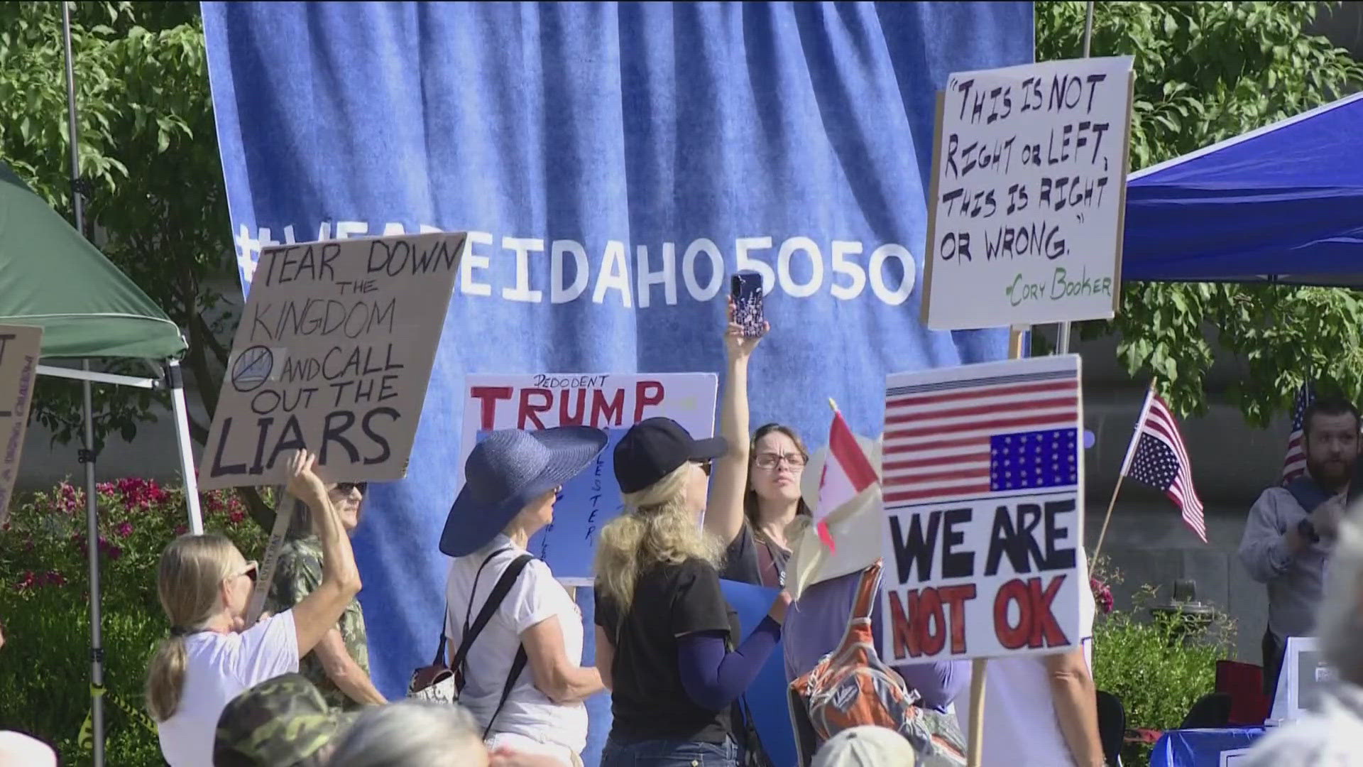 People and speakers voiced opposition to the Trump administration's recent executive actions and the impacts on working-class Americans.
