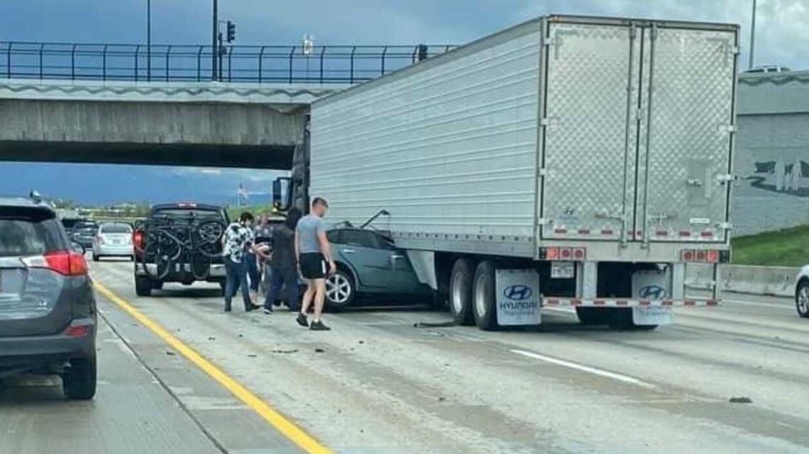 Meridian woman escapes injury after car pinned under semitrailer on I