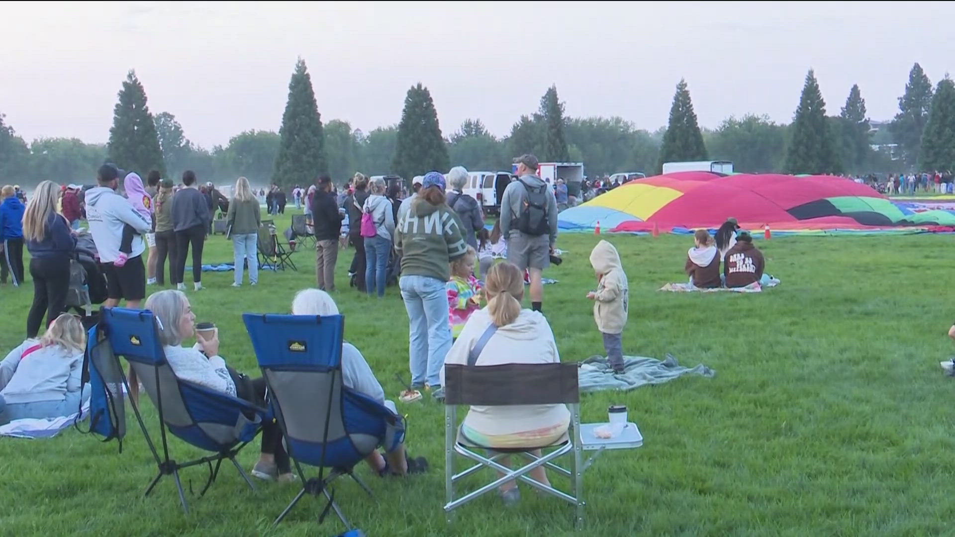 Fly high! Pilots are ready to go this morning, as the weather has allowed the hot air balloons to fly. 