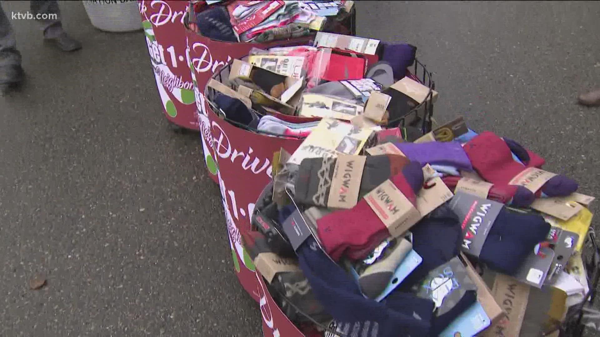 McU Sports and Mix106 teamed up with Rescue Mission to donate more than 2000 pairs of socks to people experiencing homelessness