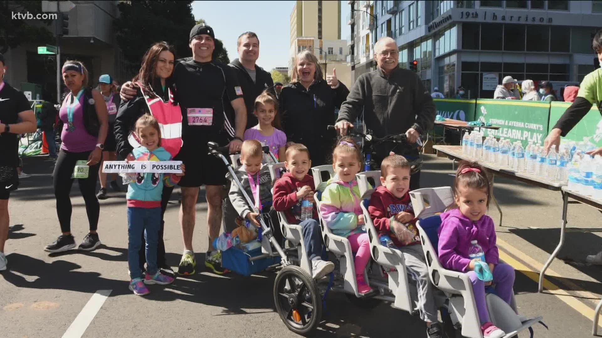 Chad Kempel ran the half marathon in 2 hours and 19 minutes while pushing his five youngest children in a stroller. Kempel is a father of seven children.