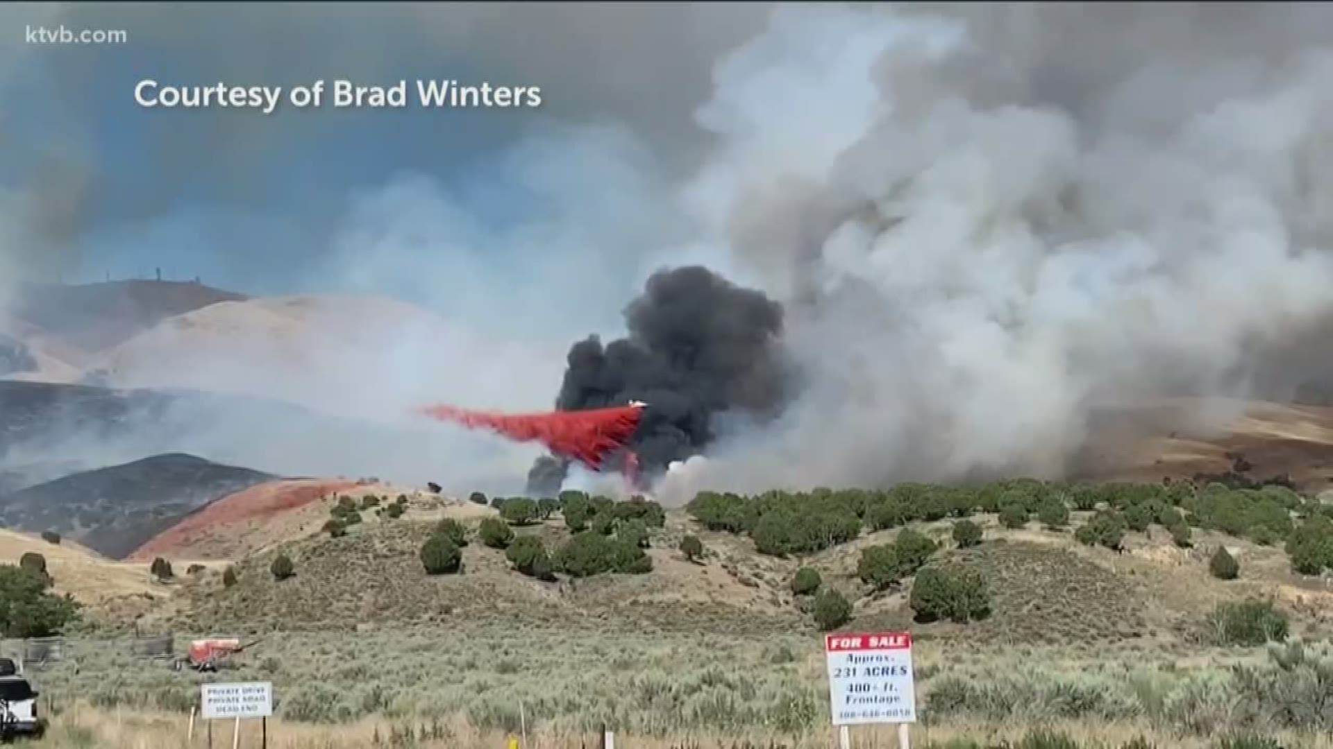 Crews are attacking the fire on Chinese Mountain from the air with retardant and water drops.