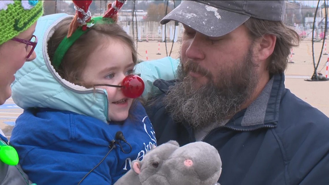 5-year-old Susanna helps light up the holidays by  turning on annual Christmas in Color light show