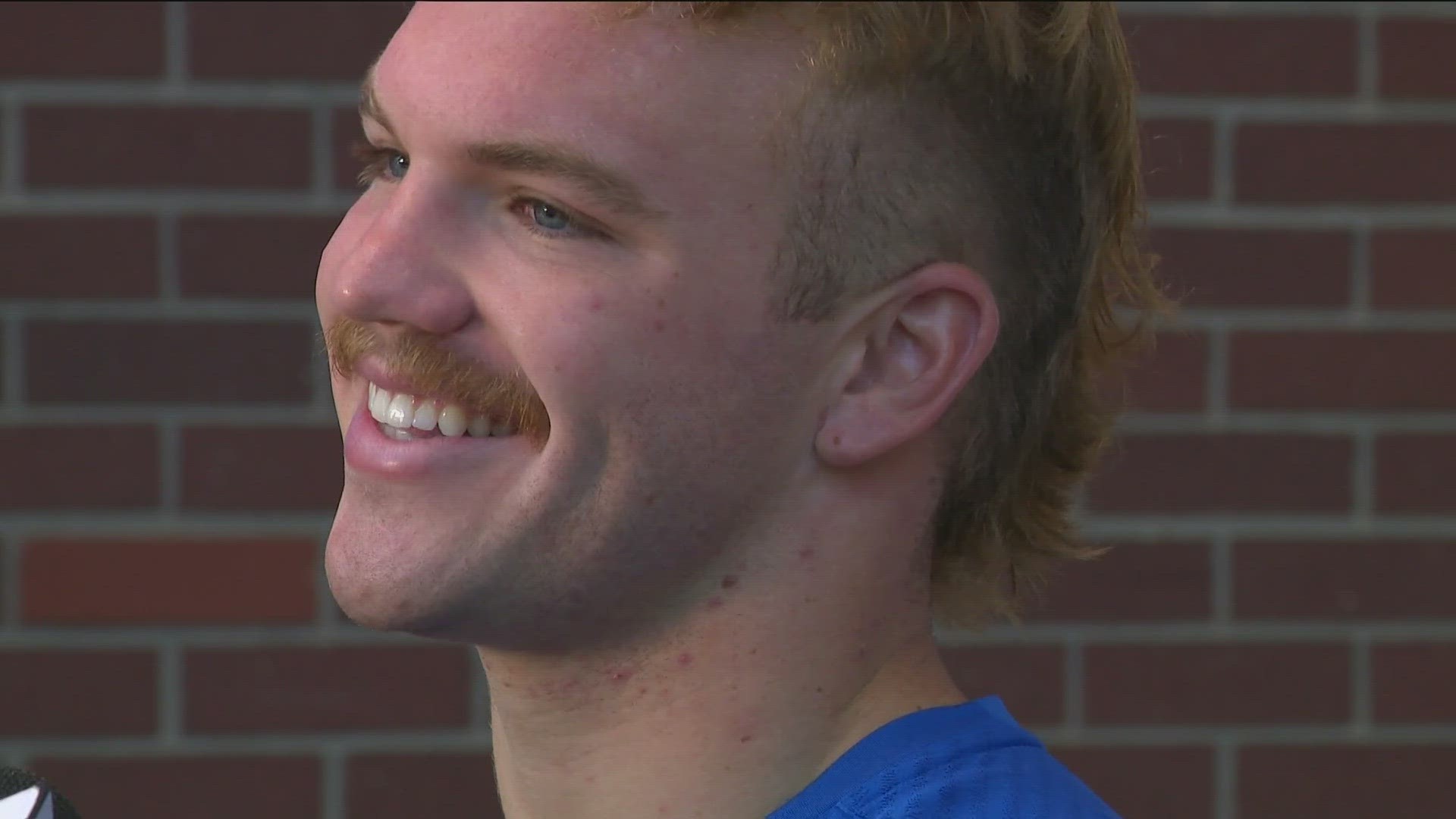 "I've just been working on my image," Teubner said. "Looks good, right? How many people do you see with a fohawk and a mustache like this man?"