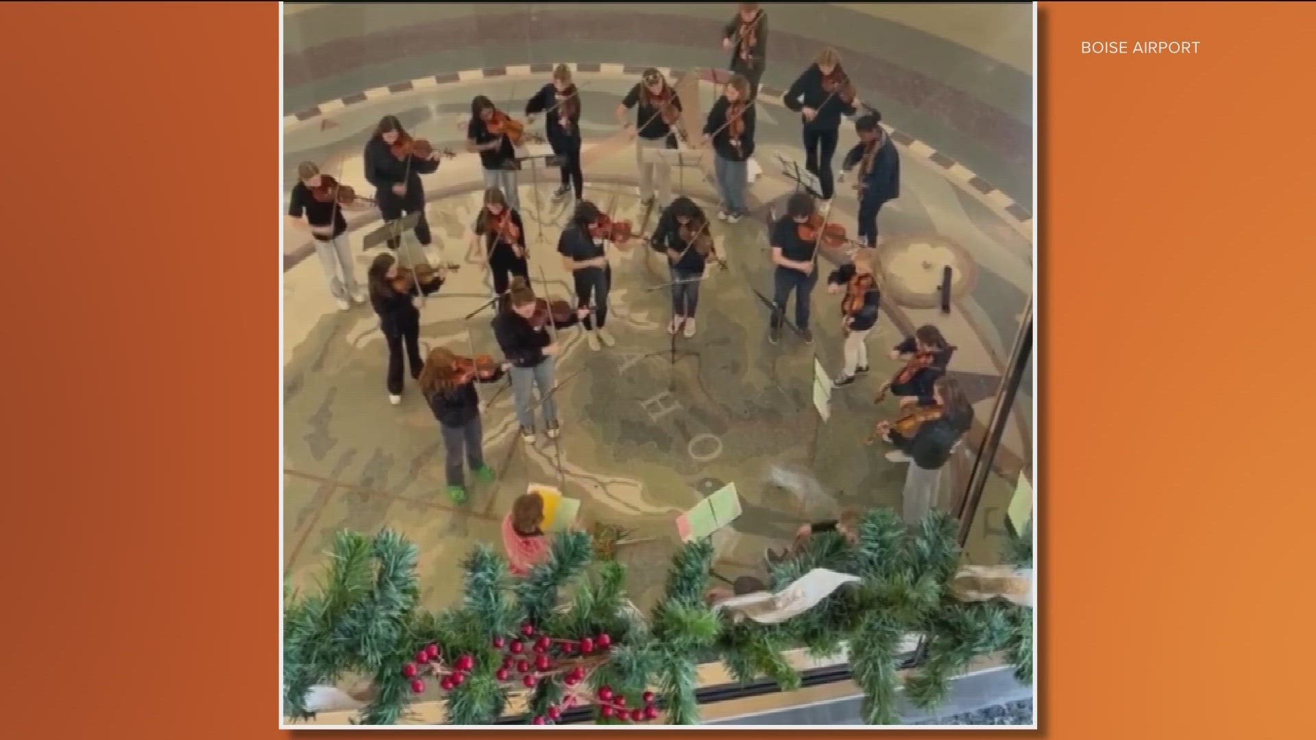 The students serenaded travelers by playing classical holiday tunes.