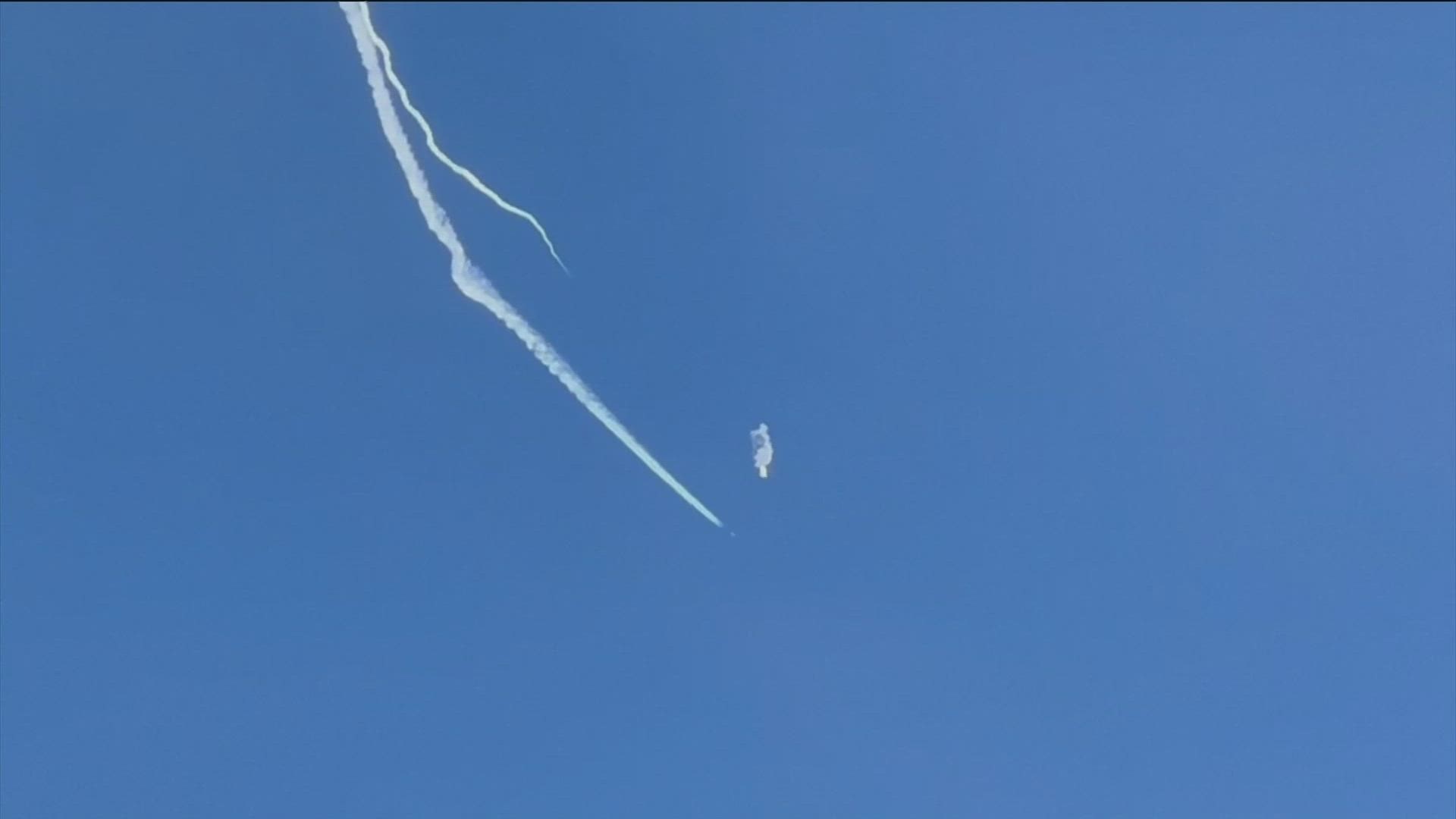 Television footage showed a small explosion, followed by the balloon descending toward the water.